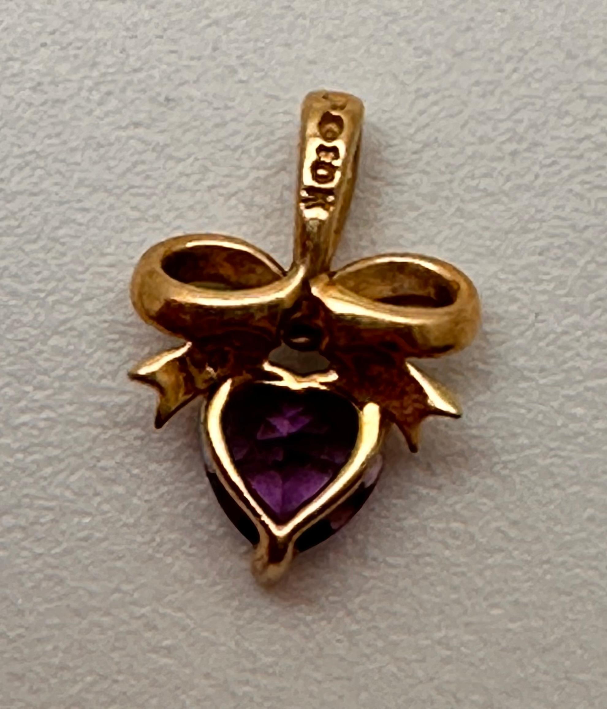 10k Yellow Gold ~ 6mm Amethyst Heart Set in a  Bow Setting  3/8