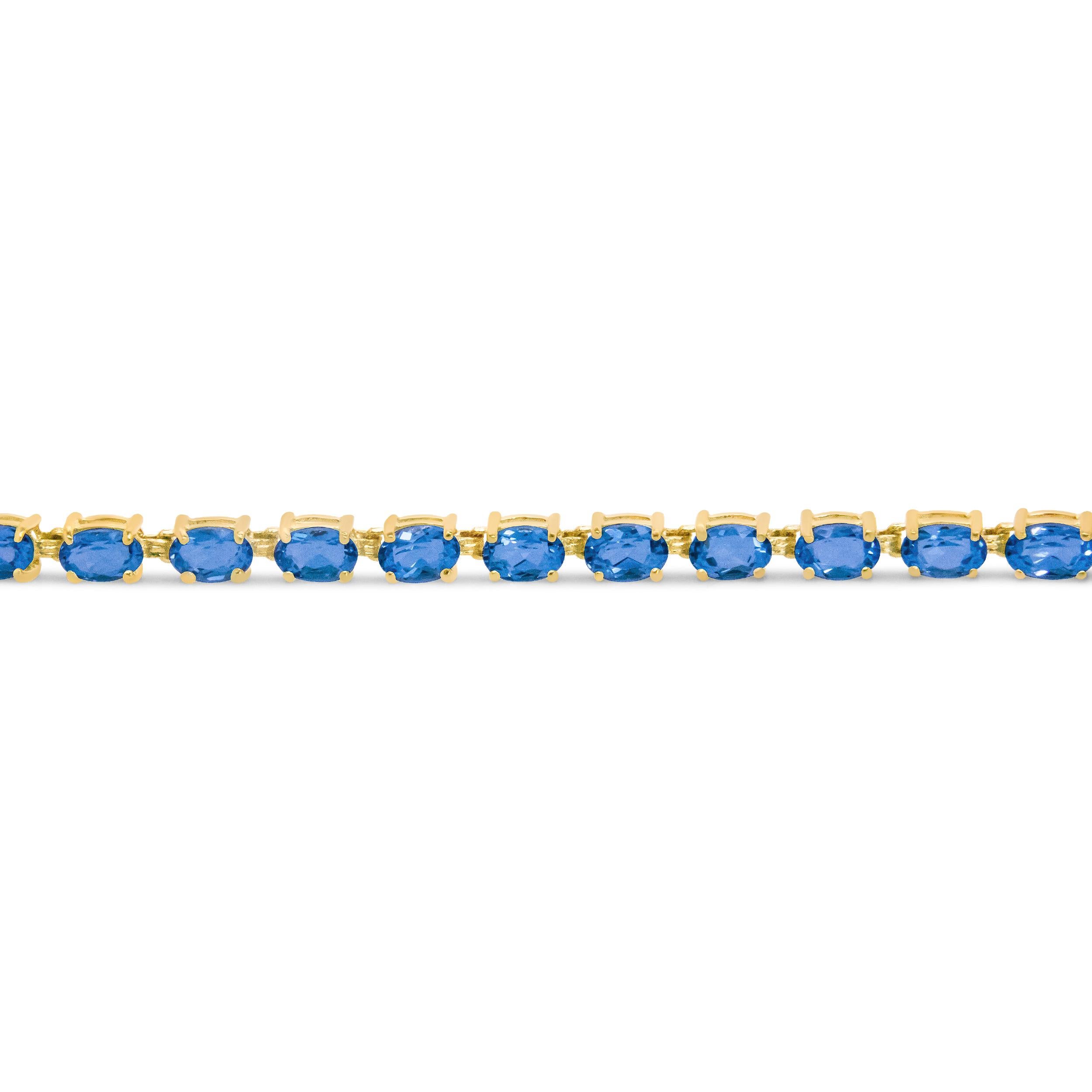 Contemporary 10K Yellow Gold and 4 Prong Set Blue Topaz Link Tennis Bracelet