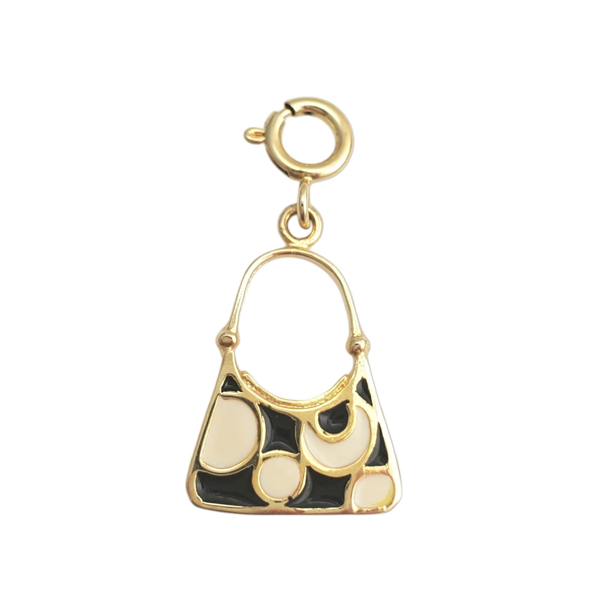 Vintage 10 karat yellow gold purse pendant -

This exquisite purse pendant is a petite accessory that adds a touch of glamour to your style and is set in beautifully detailed 10K yellow gold.

Size: 19.55mm x 13.16mm

Stamped: 10K

Weight: 0.1 gr./