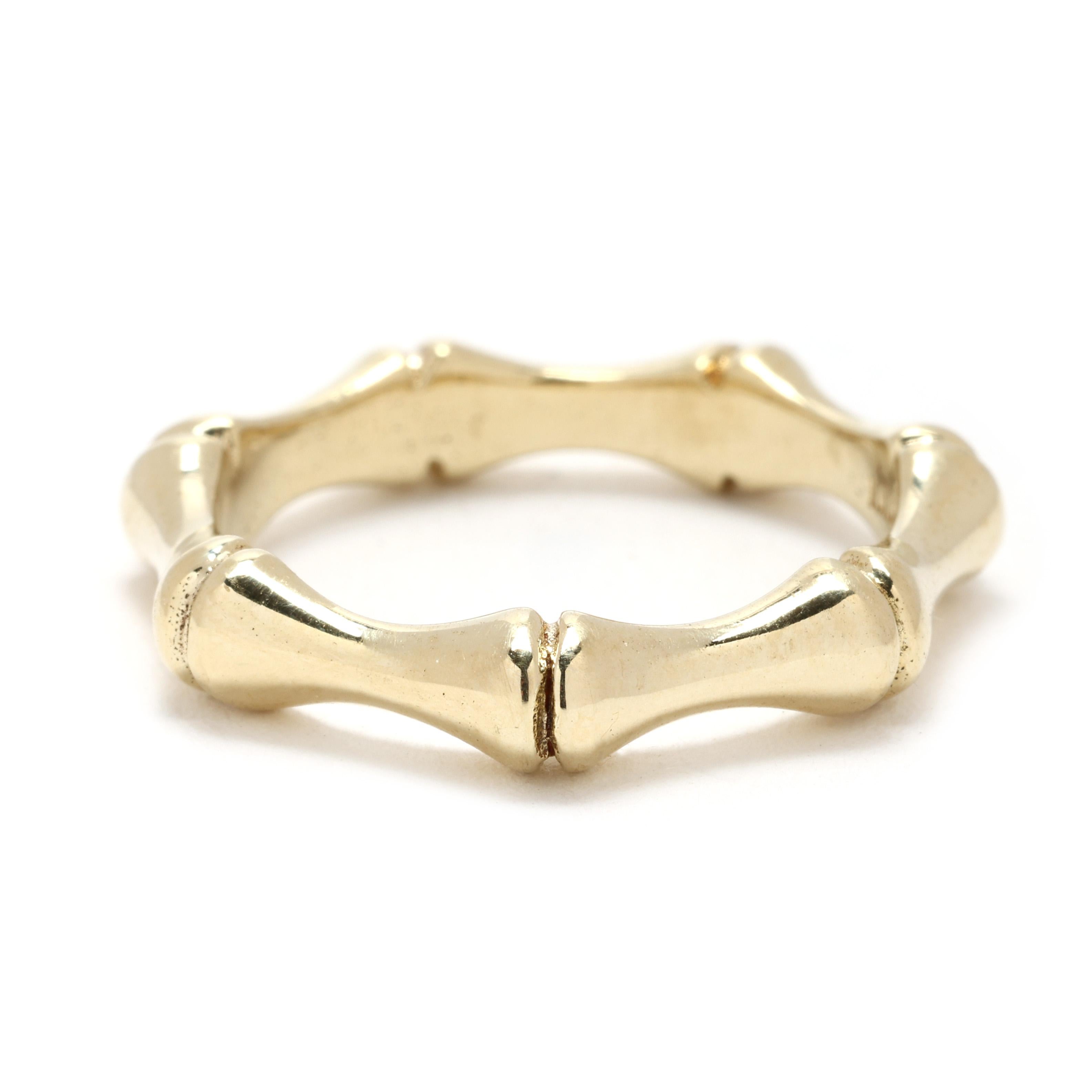Adoptez un style intemporel avec cette bague bambou en or jaune 10 carats, fabriquée en or massif pour une beauté durable. Cette bague de taille 6,25 présente un design en bambou inspiré de la nature, offrant un mélange unique d'élégance et de