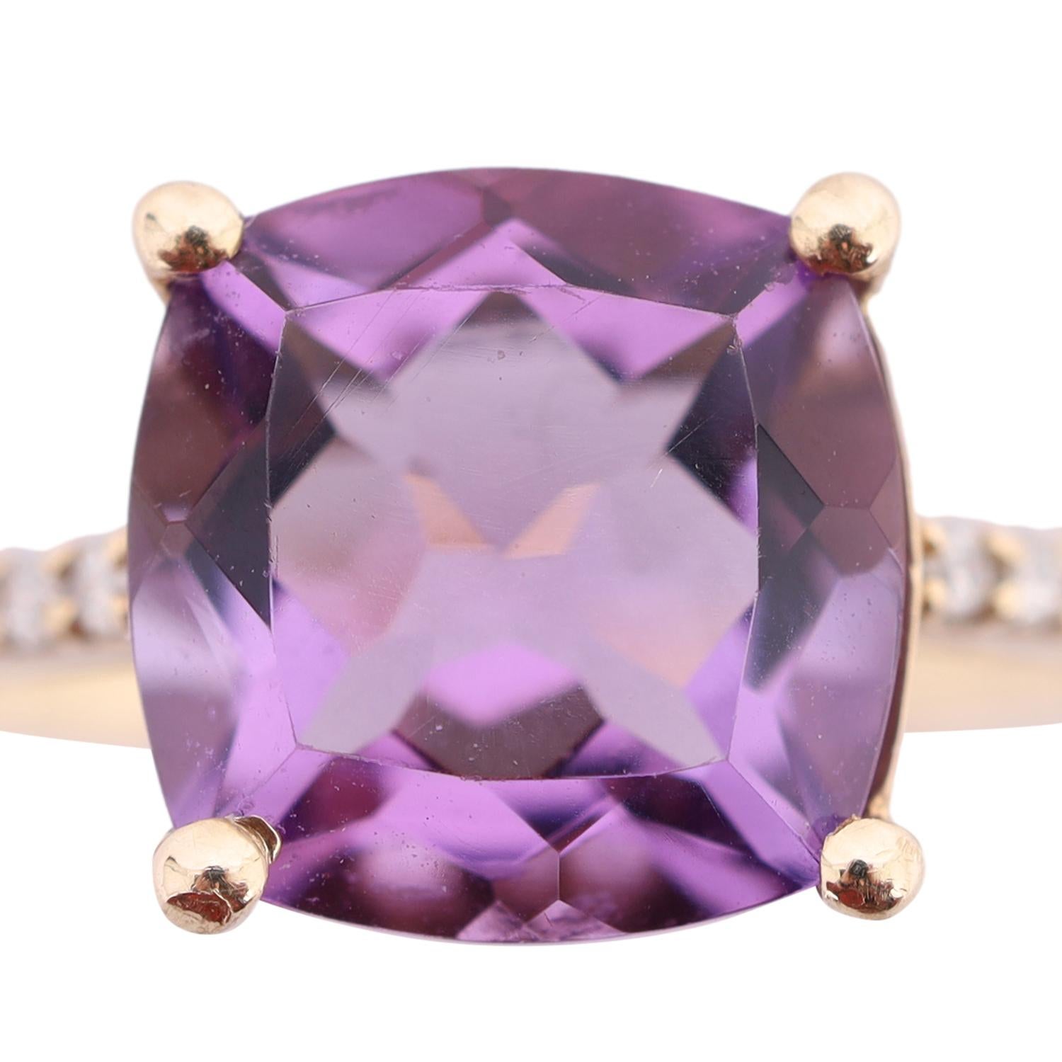 Curated by The Lady Bag Ladies 

Being offered for sale is a 10K Yellow Gold Cushion Cut Amethyst and White Sapphire Ring.

The ring features a large cushion cut and prong set amethyst as the main stone. It measures in at 8mm x 7.97mm. It is