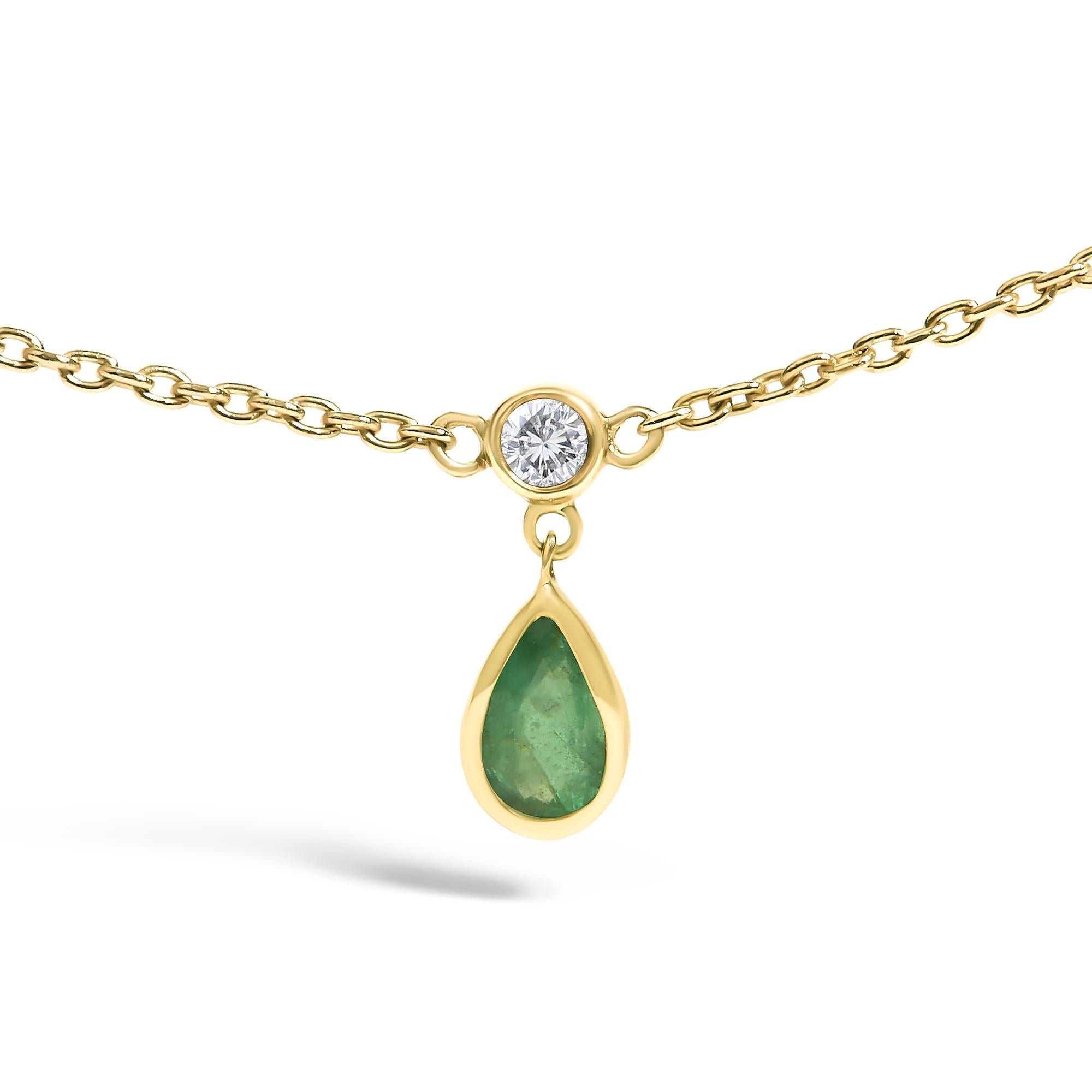 Glimmering in the light, this exquisite 18-inch necklace is forged from luminous 10K yellow gold, creating a canvas that enhances the natural beauty of its precious jewels. Five bezel-set diamonds of I-J color and SI2-I1 clarity are delicately