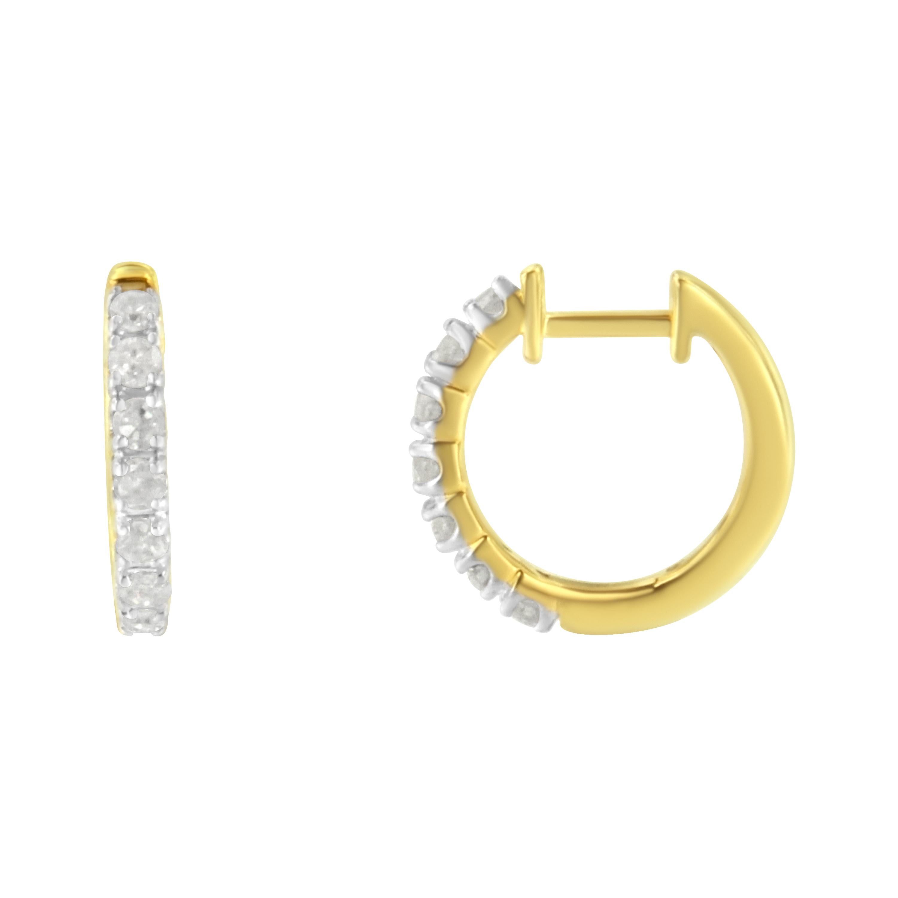 Fashioned in stunning 10k yellow gold, these beautiful huggy hoop earrings feature 1/2ct of brilliant round cut diamonds in a prong setting that delicately flow half way around the outside of the hoop. A classic piece you can wear everyday.

'Video