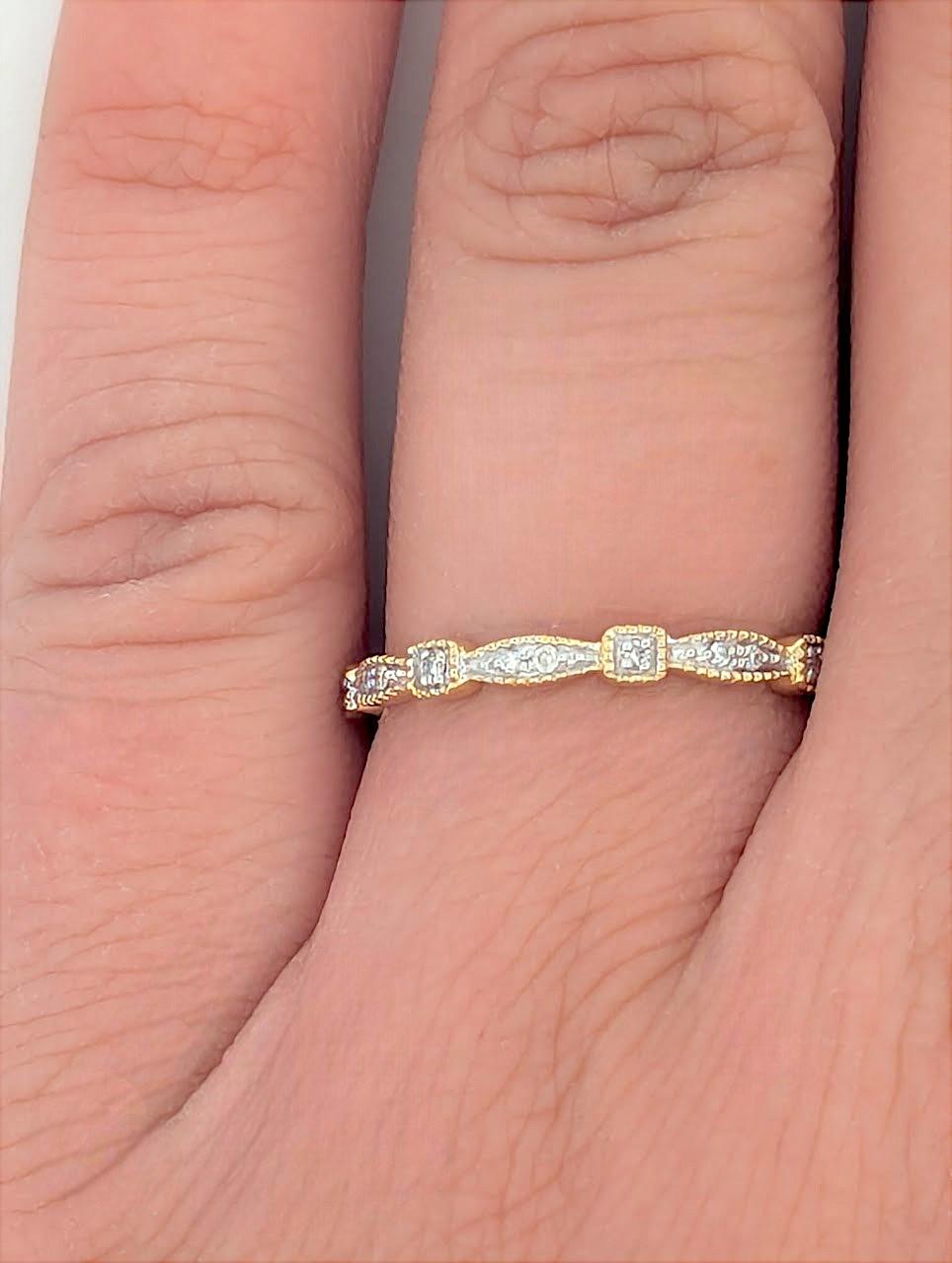 This elegant 10K yellow gold band features a subtle sparkle with .10 CTW natural diamonds, making it perfect for stacking, everyday wear, or as a classic wedding band. Its sleek and timeless design offers effortless sophistication for any jewelry