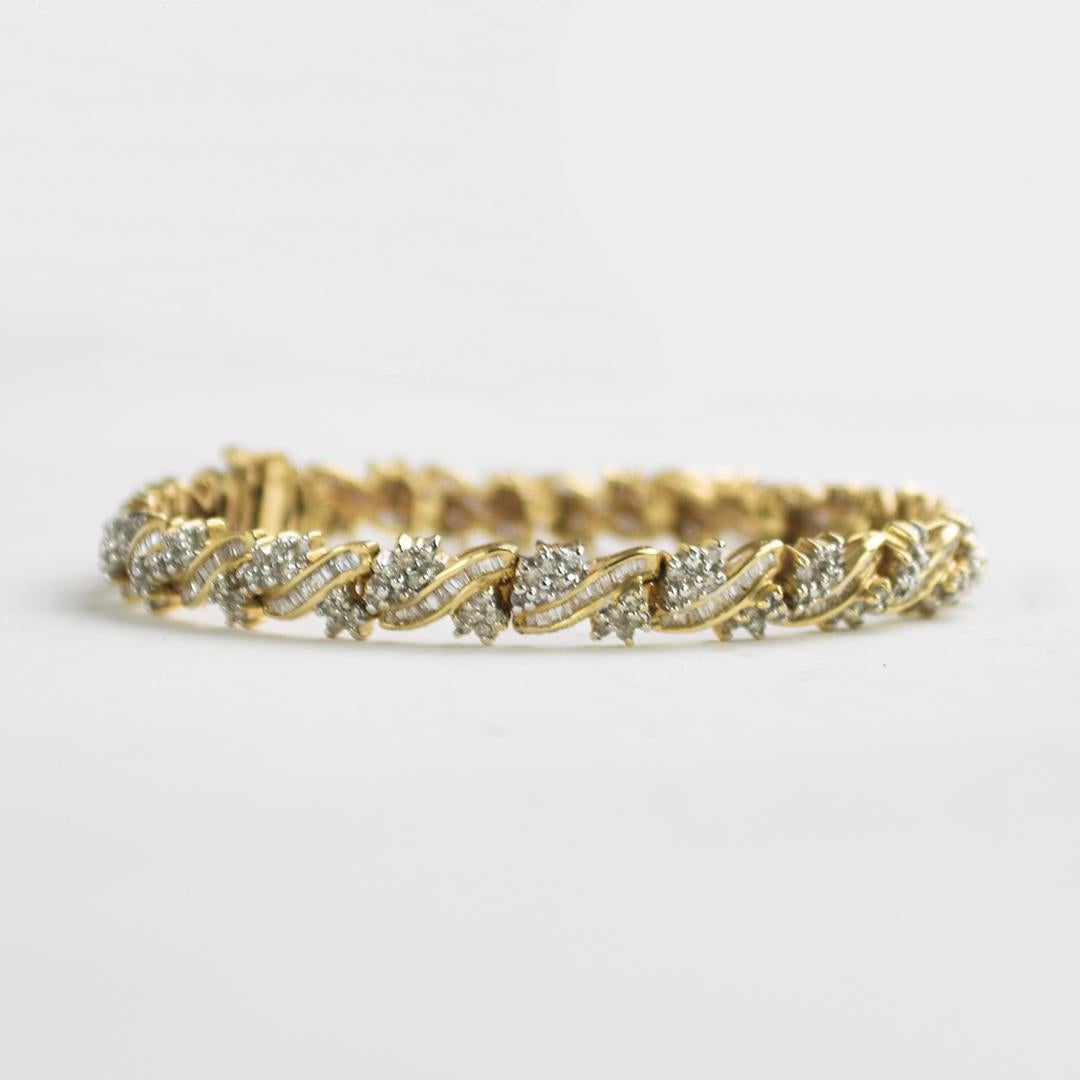 10k Yellow Gold And Diamond Bracelet.
There are 3.00 Carats of Round and Baguette Diamonds
J Color SI to I1 Clarity.
7
