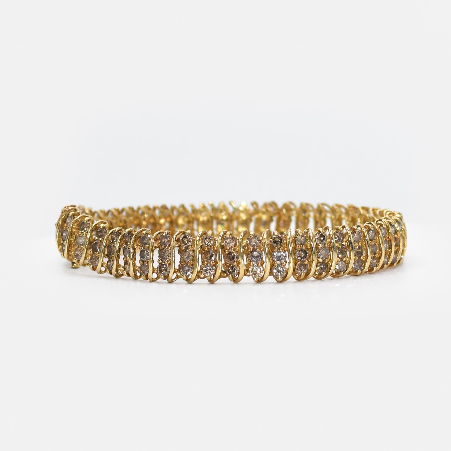 10k Yellow Gold Diamond Bracelet 7.00tcw, 17.2gr
10k Yellow Gold Diamond Bracelet with 7.00tcw. 
Diamond Clarity is I1-I2, light brown color, M +.
Stamped 10k, weighs 17.2gr.
Will fit a 7 1/2in wrist.