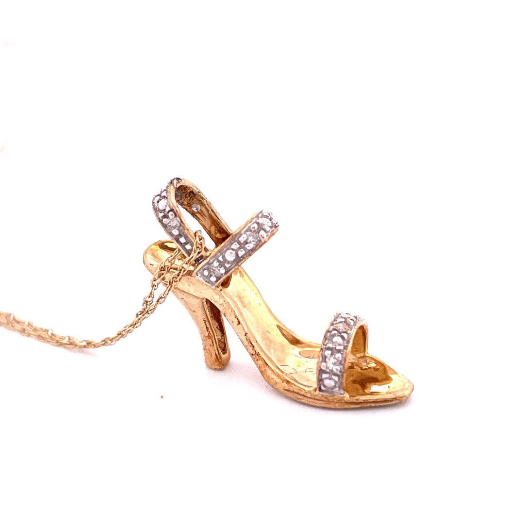 10k Yellow Gold Diamond Heel Necklace

 Elevate your style with our charming Diamond Heel Necklace crafted in 10k yellow gold. The pendant showcases heel adorned with shimmering diamonds, totaling 0.1 carats in weight. This necklace weighs 2.6 grams