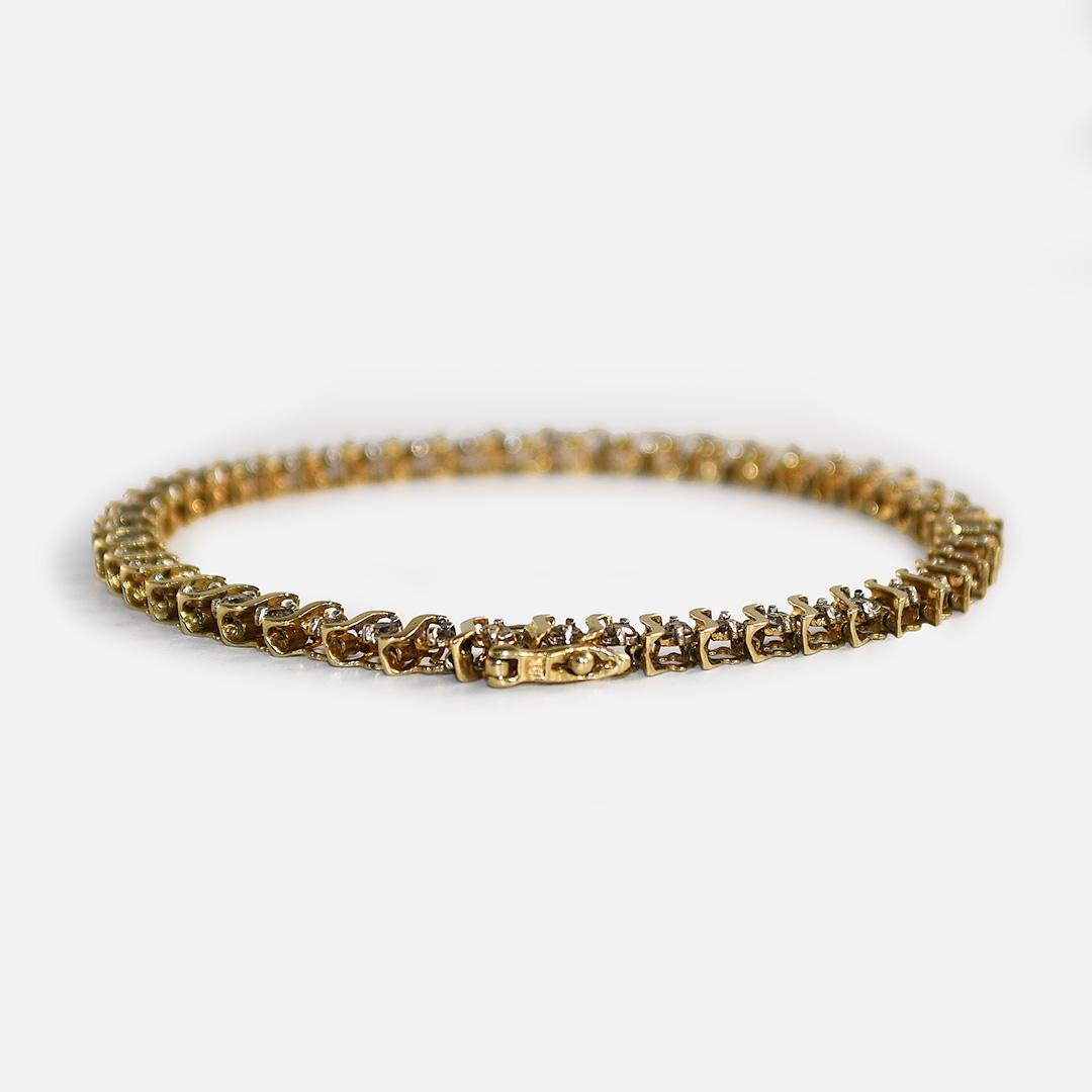10k yellow gold tennis bracelet.
There is 1.00tdw in round brilliant cut diamonds.
Slightly brown stones, M-N Color, SI-I1 Clarity 
Weighs 7.4g
will fit 7 1/2 in wrist