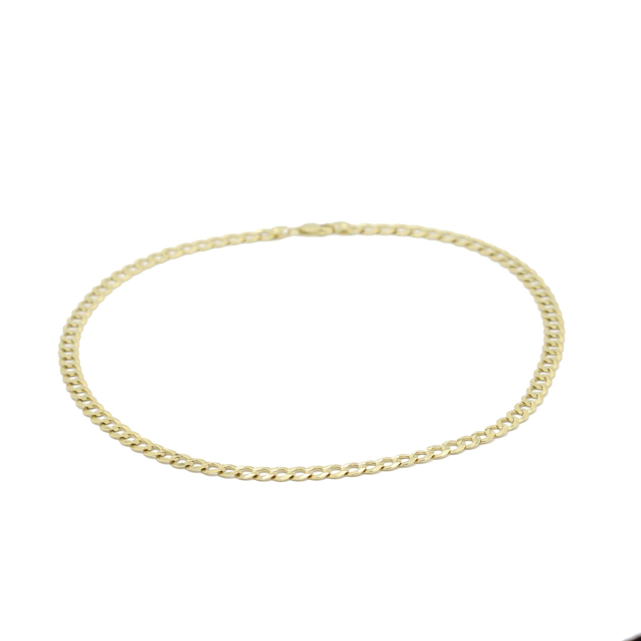 One lady's manufactured polished 10K yellow gold flat cuban link chain. The chain measures approximately 20.00 inches in length by 7.00mm in diameter and weighs a total of 22.20 grams. Engraved with 