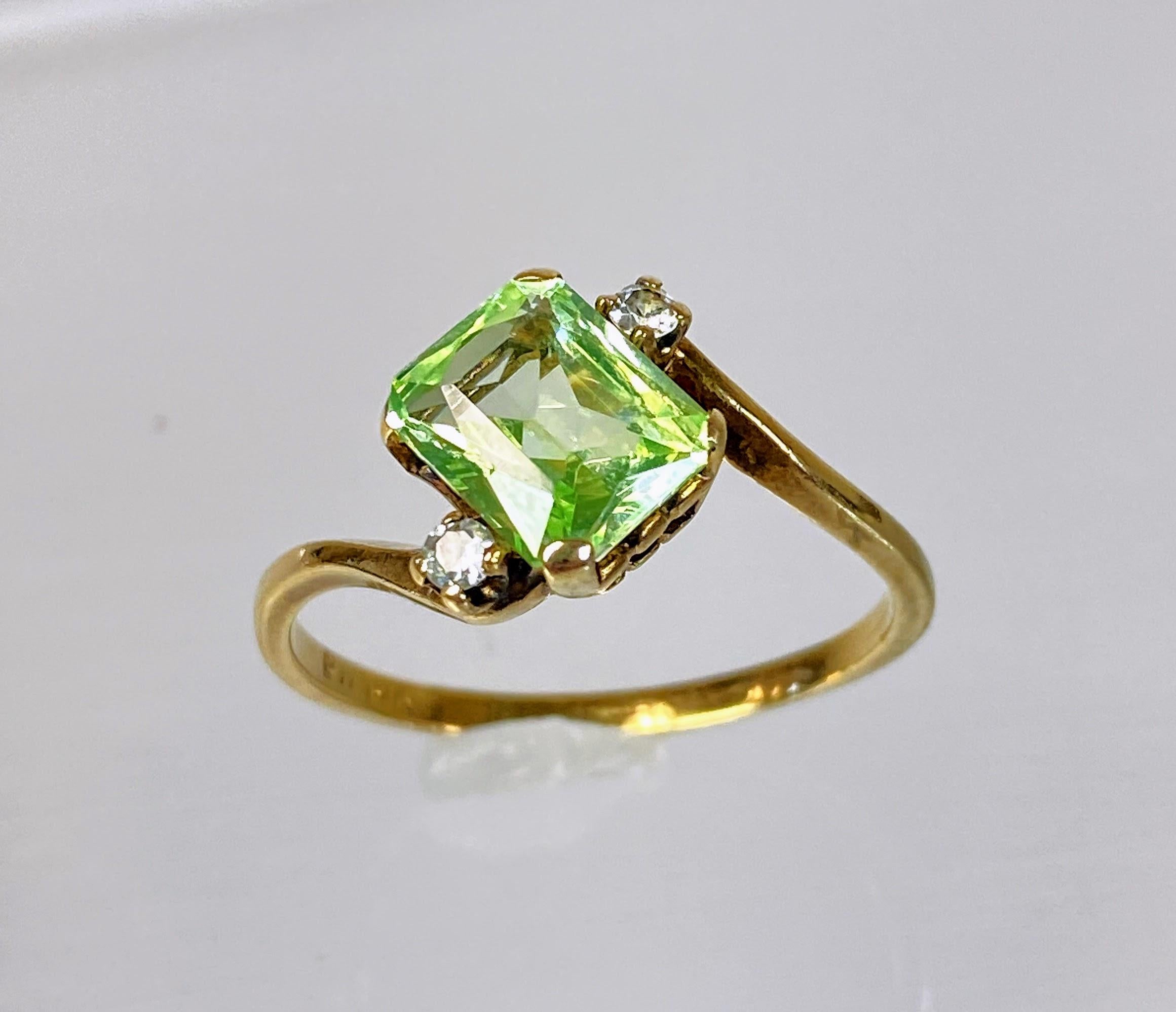 At first glance, this piece looks as if it must be made of uranium glance. Upon closer examination, the retro and funky green glows just a bit differently. 

This vintage-inspired solitaire ring exudes timeless elegance with its classic design,