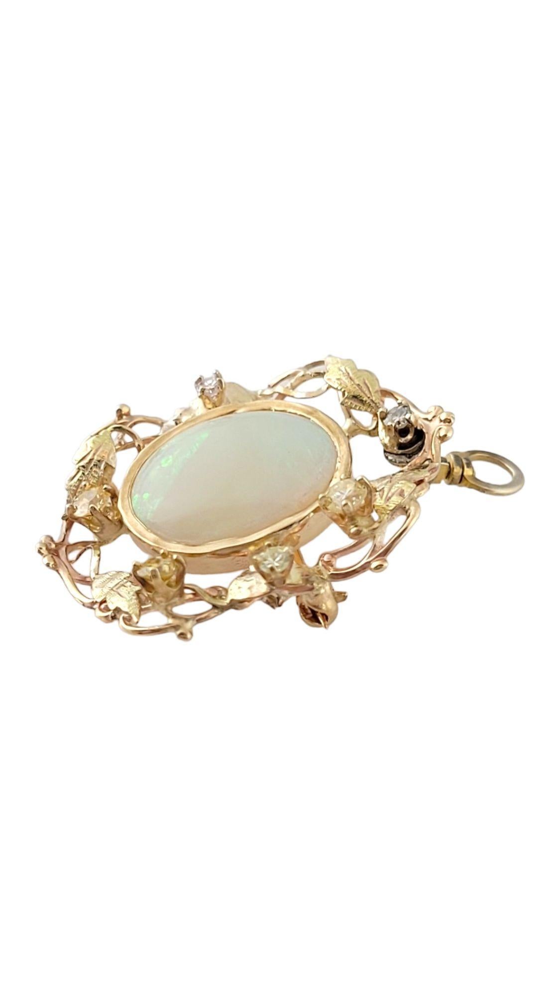 Vintage 10K Yellow Gold Opal and Diamond Pin/Pendant

This gorgeous pin has a beautiful opal set in 10K yellow gold and surrounded by 6 sparkling, single and round brilliant cut diamonds, and it even doubles as a pendant!

Approximate total diamond