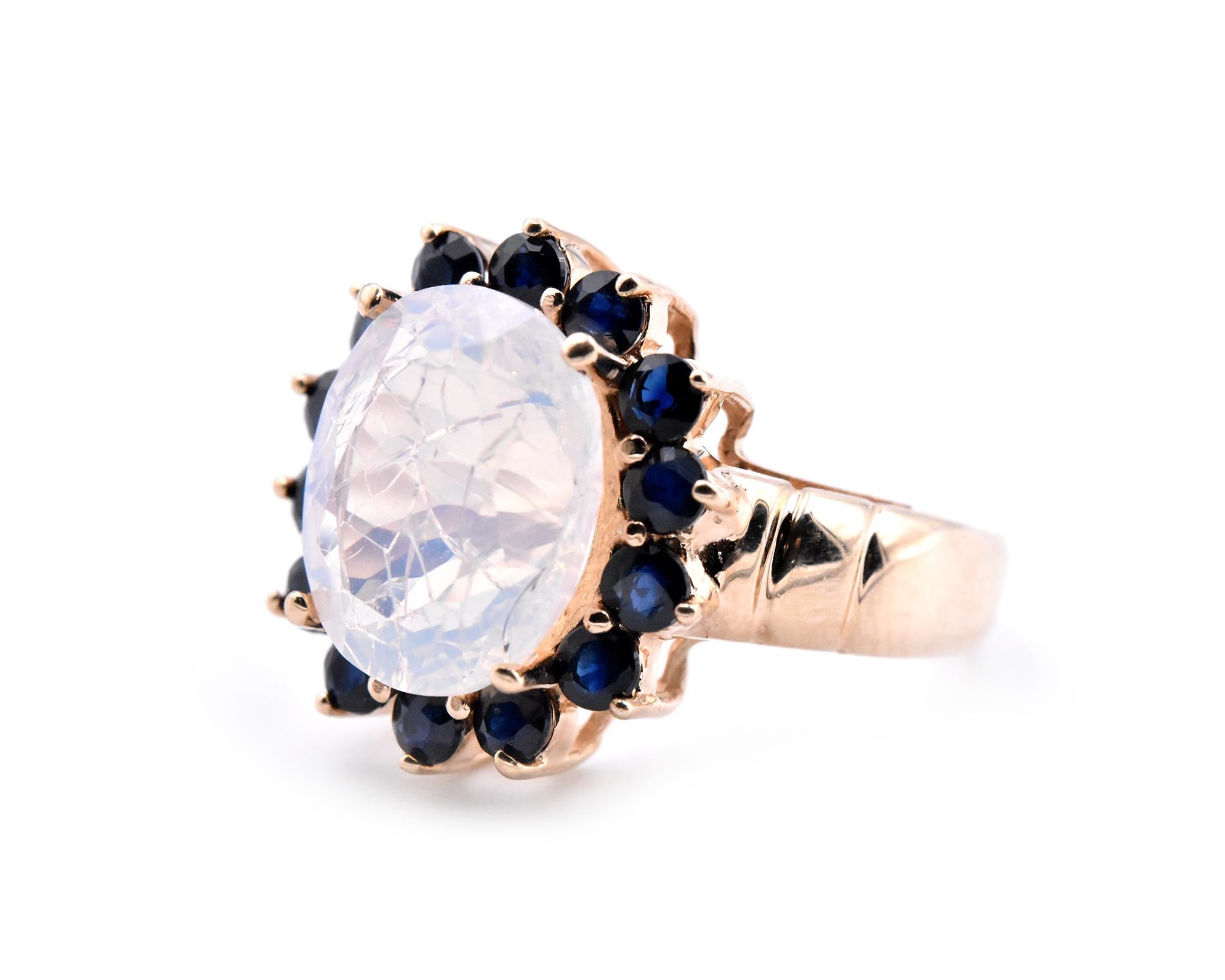 Oval Cut 10 Karat Yellow Gold Opal and Sapphire Halo Ring