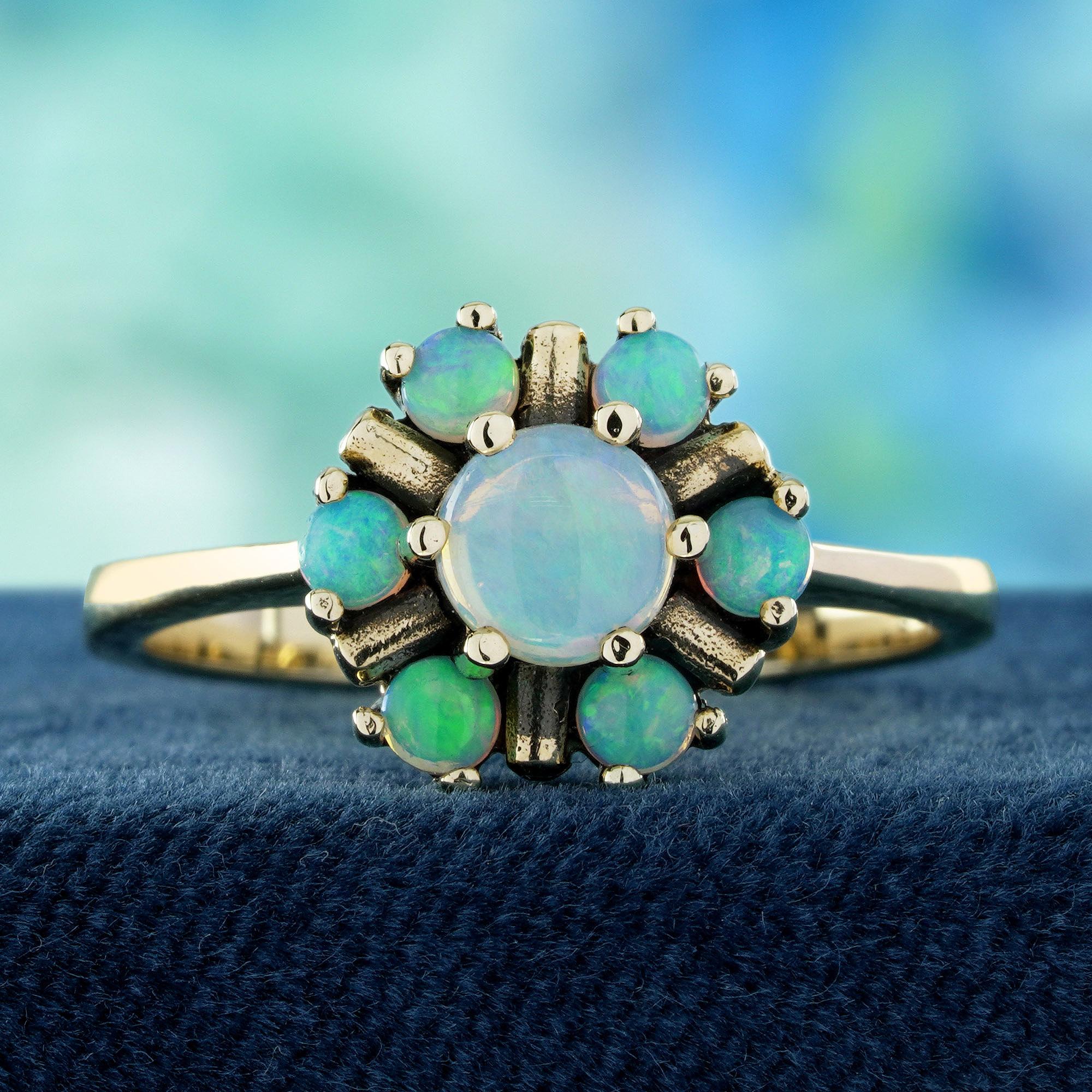 Fall in love with the delicate beauty of this Opal and Diamond Vintage-Style Cluster Floral Ring. Featuring a glowing central opal surrounded by petal-like opals in a prong setting, it captures the charm of a blooming flower. Accented with sparkling