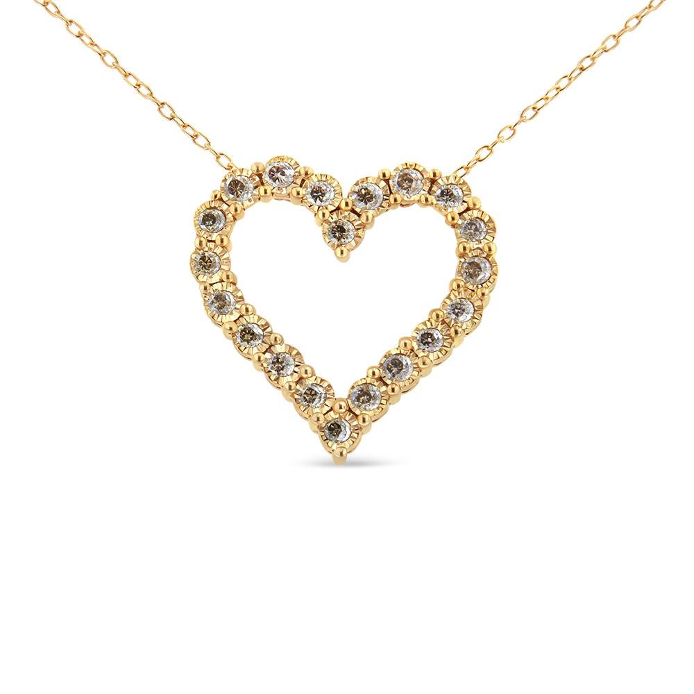 Lovely and elegant, this 10kt yellow gold plated 925 sterling silver heart pendant is embellished with 20 sparkling, champagne color diamonds. The diamonds are round-cut and have a total carat weight of 1/2 c.t. Set in a miracle plate setting, the