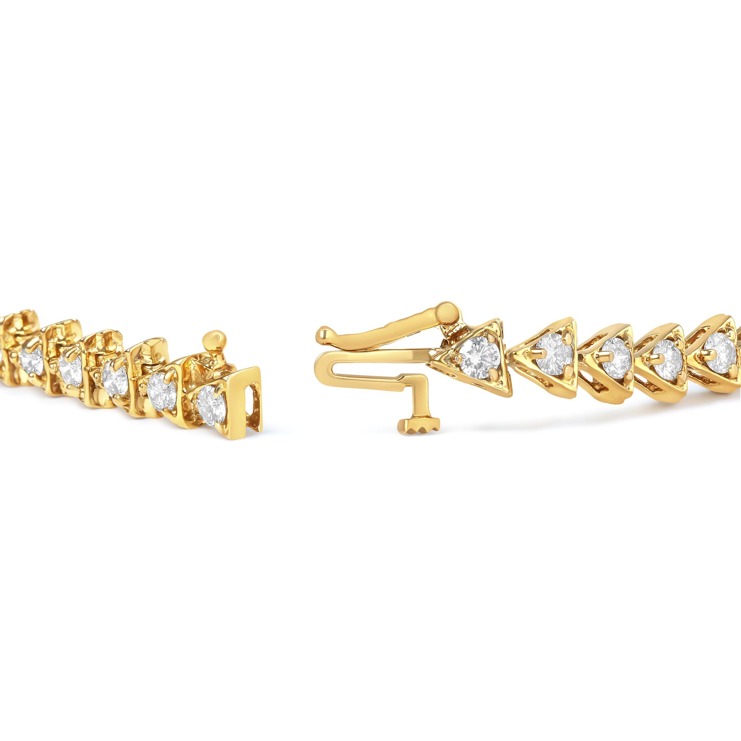 Our bracelet is the perfect way to add a touch of sparkle to your everyday wardrobe. The bracelet features 10K yellow gold plated .925 sterling silver links, each shaped like a triangle and set with a natural diamond. The 3.0 Cttw of diamonds are