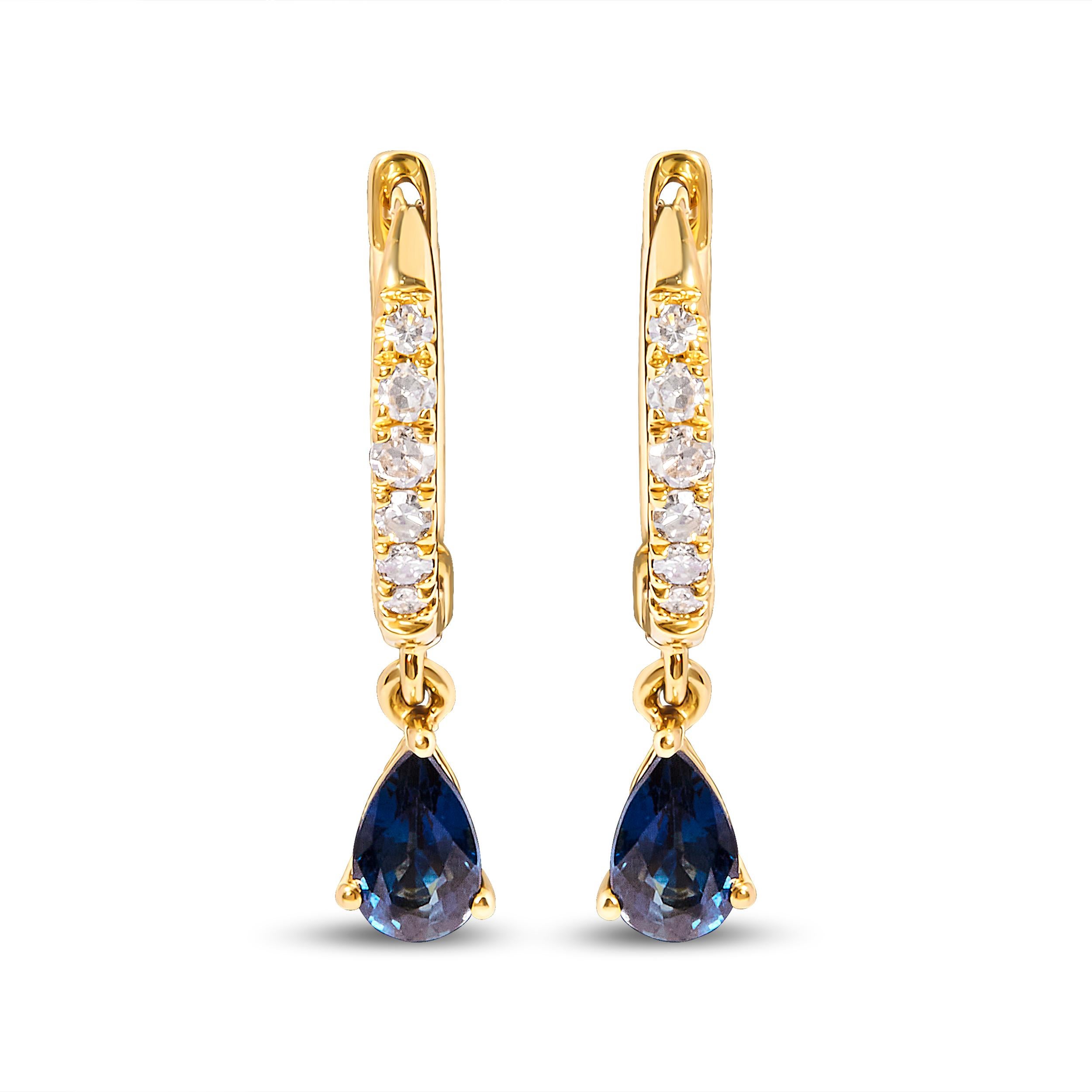 Indulge in the captivating allure of these 10K Yellow Gold Pear Blue Sapphire and Diamond Drop and Dangle Huggy Hoop Earrings. Crafted with meticulous attention to detail, these earrings boast a stunning design that effortlessly combines elegance