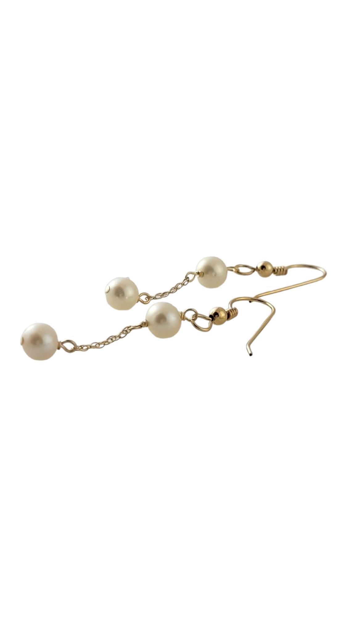 10K Yellow Gold Pearl Dangle Earrings

This gorgeous set of dangle earrings features 4 stunning white pearls!

Pearls: 6.1mm

Size: 45mm X 6 mm X 6 mm

Weight: 1.0 dwt/ 1.7 g

Tested 10K

Very good condition, professionally polished.

Will come