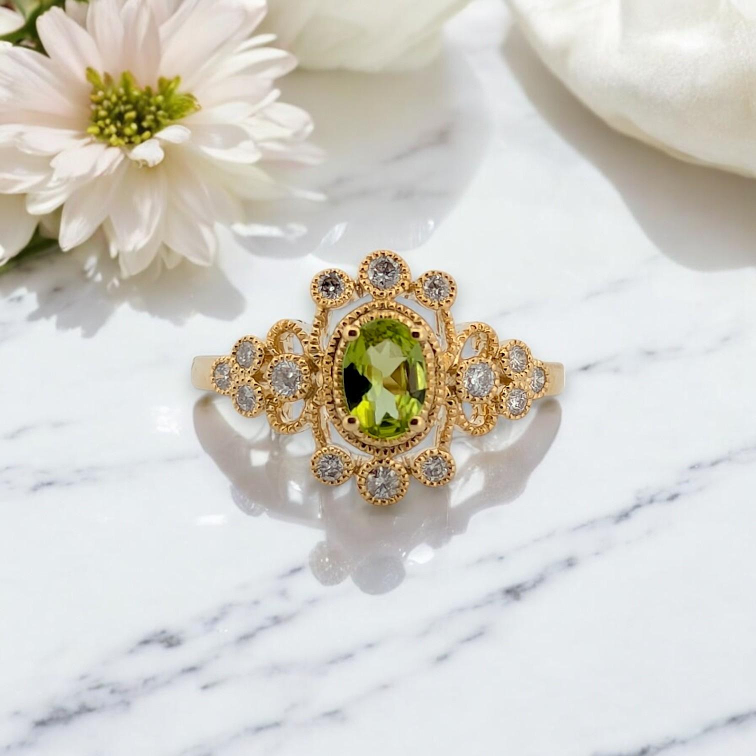 This stunning 10K yellow gold ring features a vibrant 0.45 CTW natural oval Peridot, beautifully encircled by 0.25 CTW natural round diamonds in a classic halo setting. The rich green hue of the August birthstone is enhanced by the brilliance of