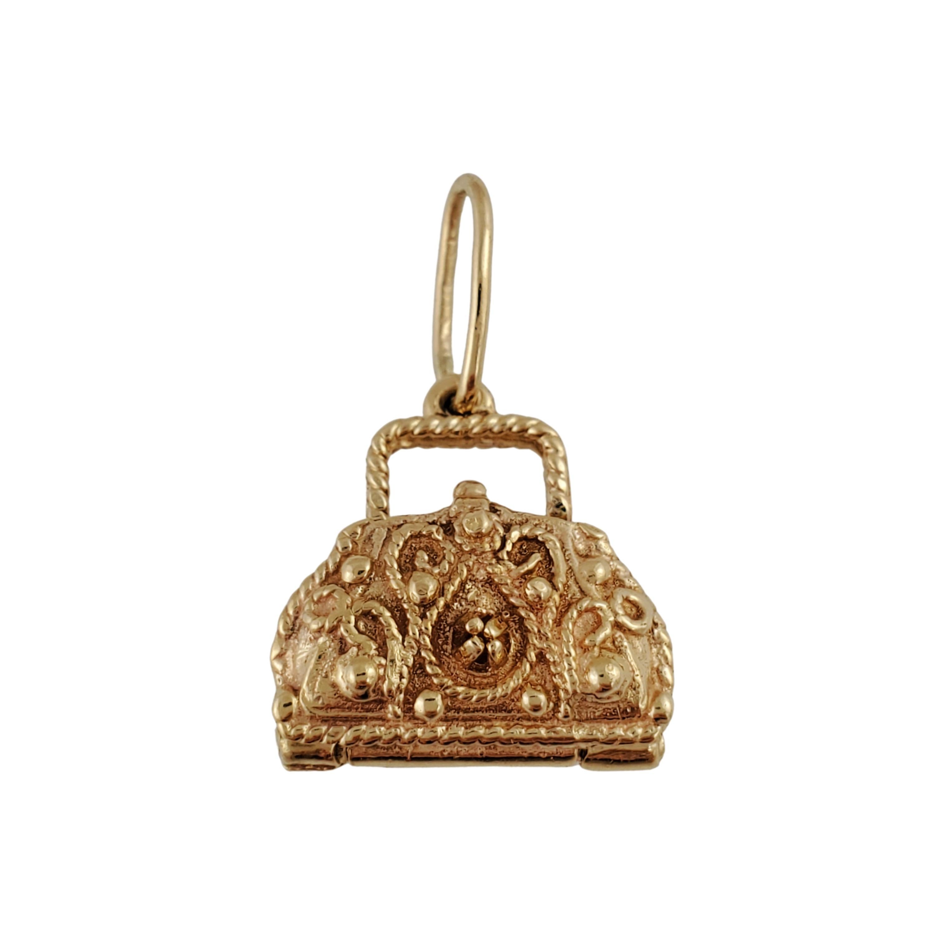 10K Yellow Gold Purse Charm 

Beautiful vintage 10K yellow gold purse charm for that person who loves purses! 

Size: 14.96mm X 14.95mm

Weight:  3.8gr /  2.4dwt

Hallmark: 

Very good condition, professionally polished.

Will come packaged in a