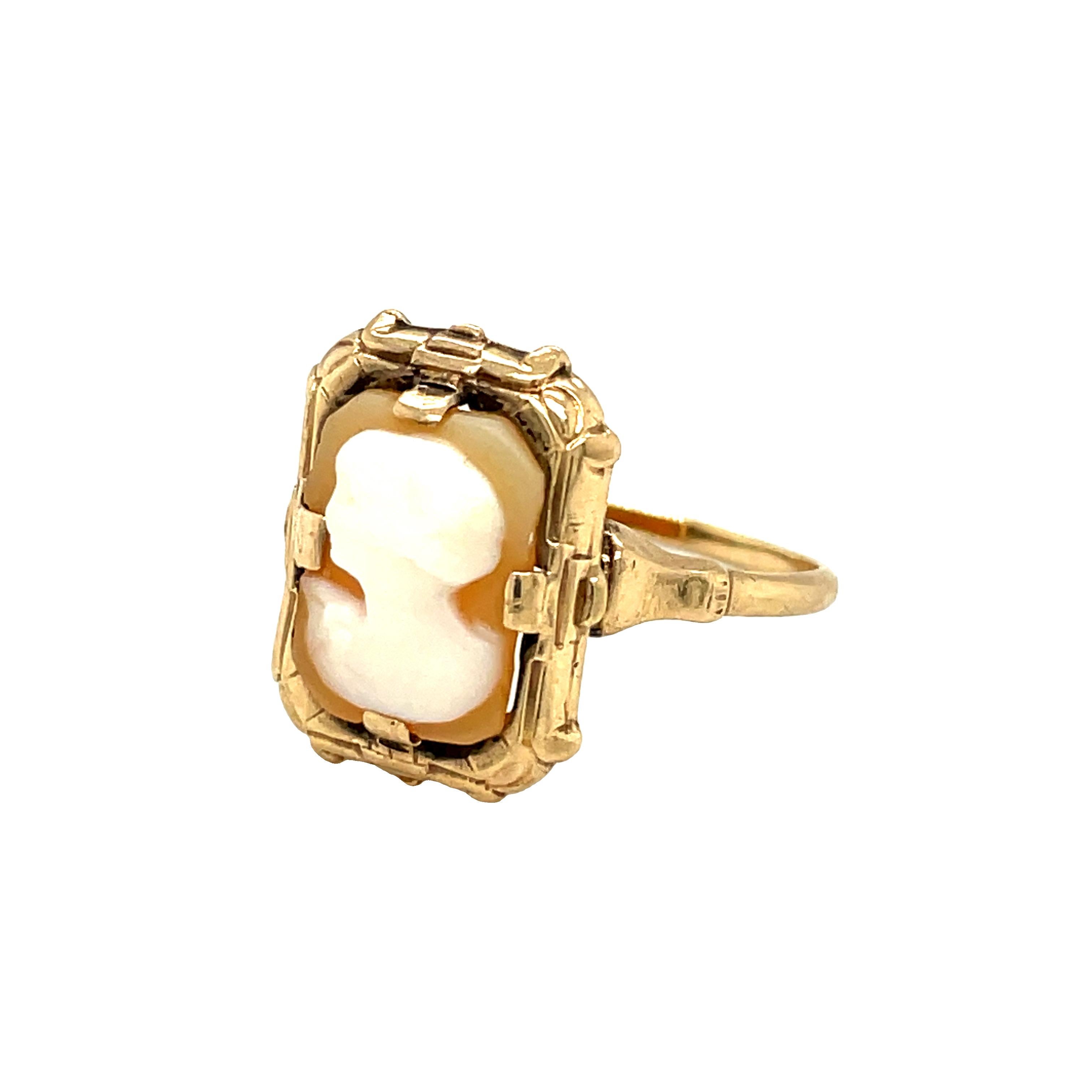 This lovely vintage cameo ring features a rectangle shaped hand carved shell cameo of a lovely lady in profile set in classic 10K yellow gold. The cameo is well carved and set in a decorative frame.  
Cameo measures 12 x 9mm

Metal: 10K
Ring size: