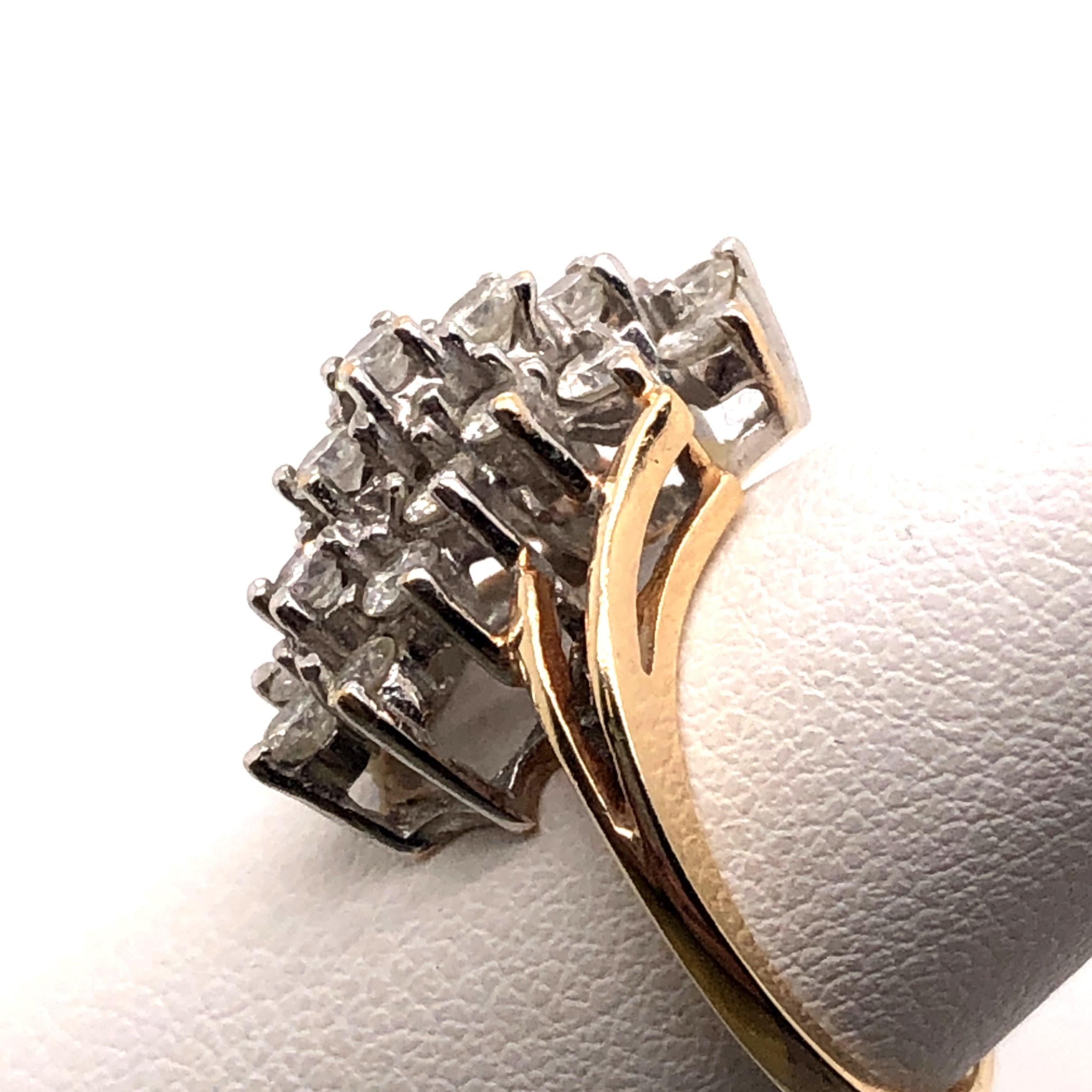 10KT yellow and white gold approximately .75-.85TCW H-I/SI2-I1 Diamond Cluster Ring. This ring is set with the diamonds diagonally on your finger. 
 
This ring is a finger size 6.25 and can be resized.