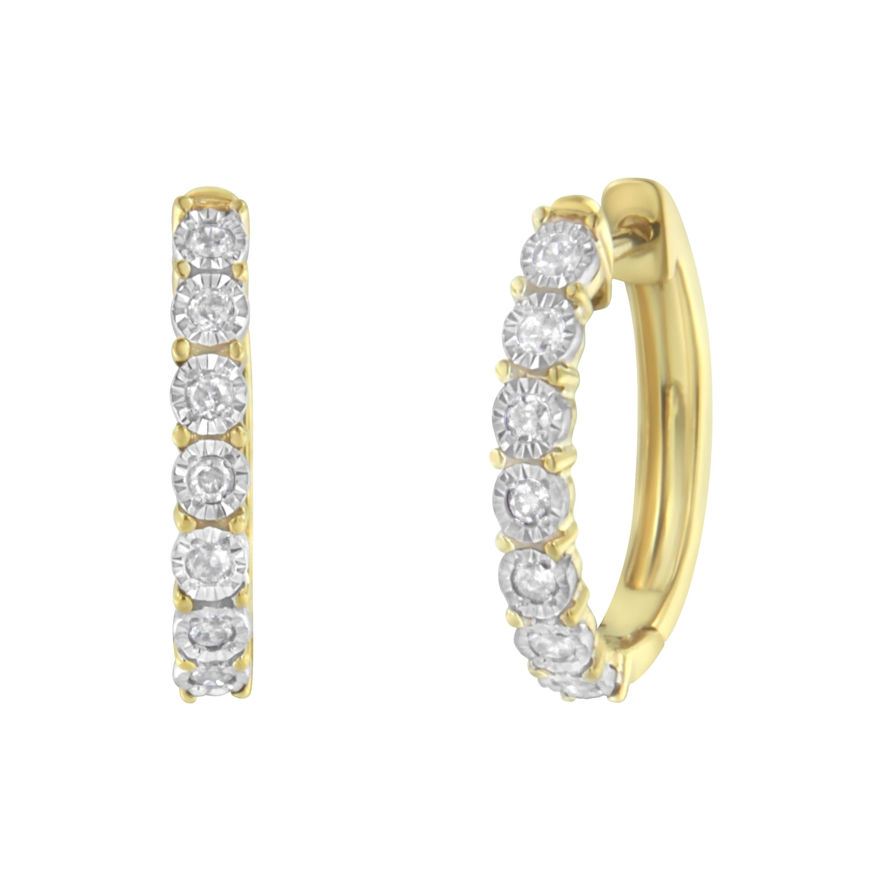 Fashioned in stunning 10k two-toned gold, these beautiful hoop earrings feature 1/4ct of brilliant round cut diamonds in a miracle setting that delicately flow half way around the outside of the hoop. A classic piece you can wear everyday.

