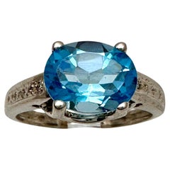 10kt White Gold ~ 8mm x 10mm Oval Blue Topaz 2 Side Diamond Ring Size 7