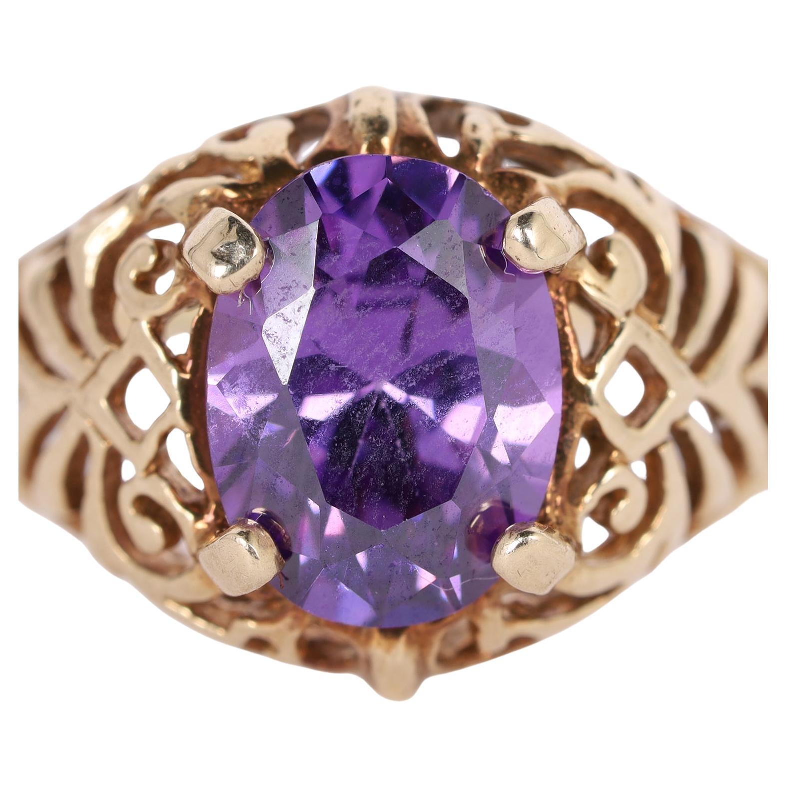 Curated by The Lady Bag Ladies 

Being offered for sale is a 10Kt Yellow Royal Purple Amethyst Solitaire Ring Size 8.5

This ring features an oval cut and prong set royal purple amethyst as the main and only stone. It measures 7.95mm in length and