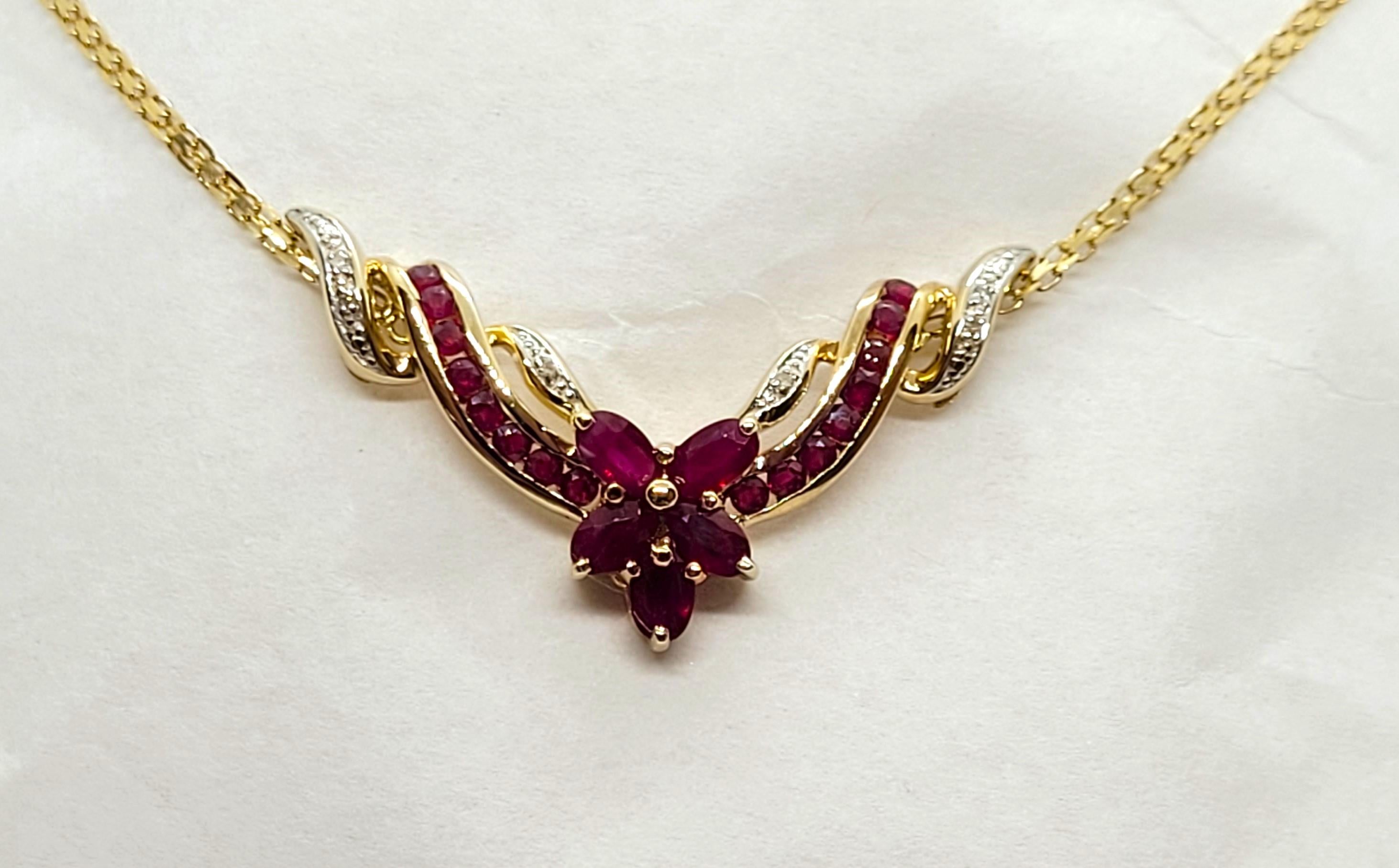 10kt Yellow Gold Ruby Diamond Necklace 17.5 In, 1.75cttw Rubies, .05cttw Diamond. This is a stunning necklace made of 10kt yellow gold, adorned with five oval rubies of approximately 1.25cttw, sixteen round rubies of approximately .50cttw, and 6