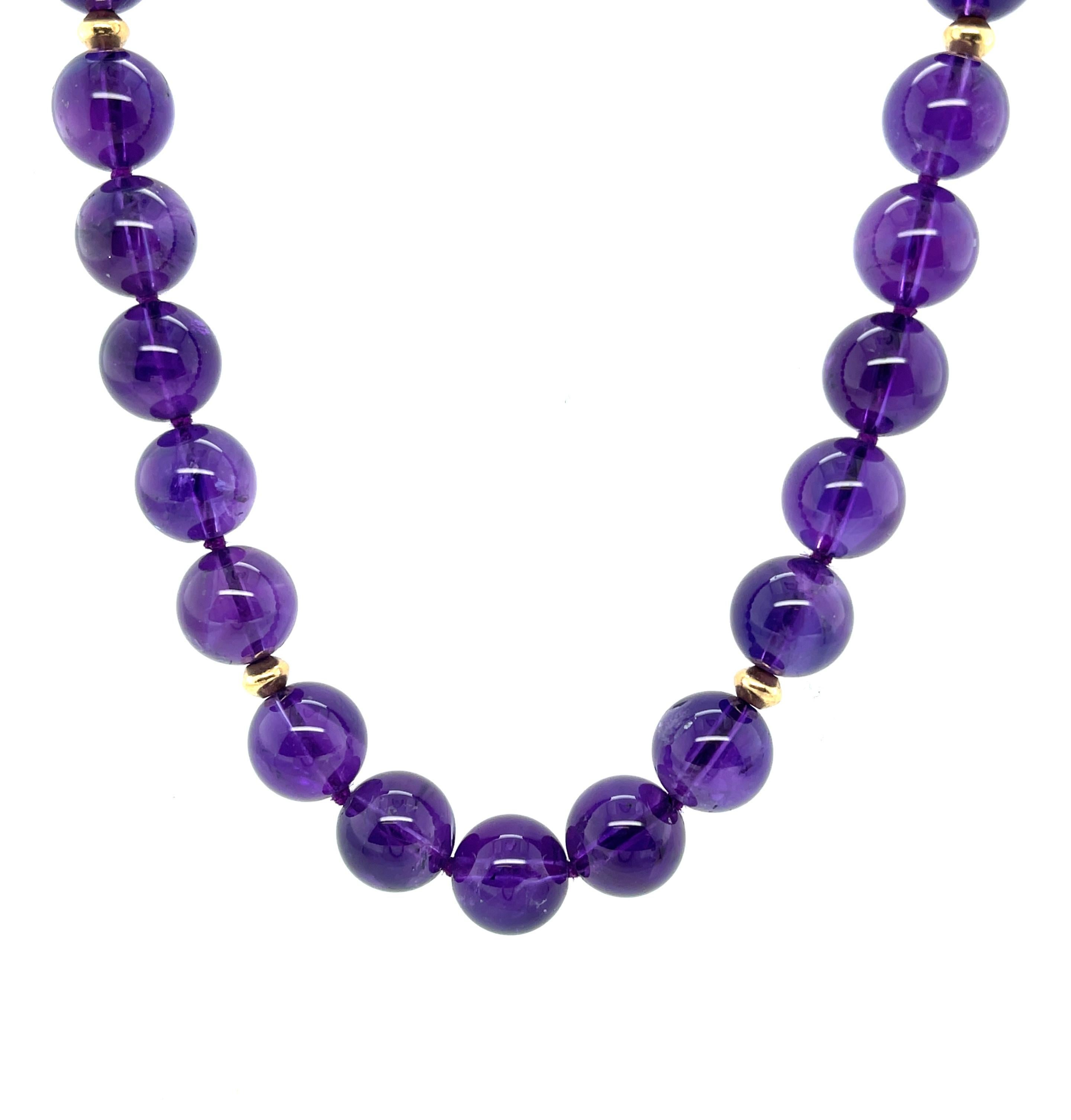 This fine quality amethyst necklace features beautifully matched amethyst beads with gorgeous, even purple color. The 10mm beads have been arranged with bright, 18k yellow gold spacers, elevating this necklace to 