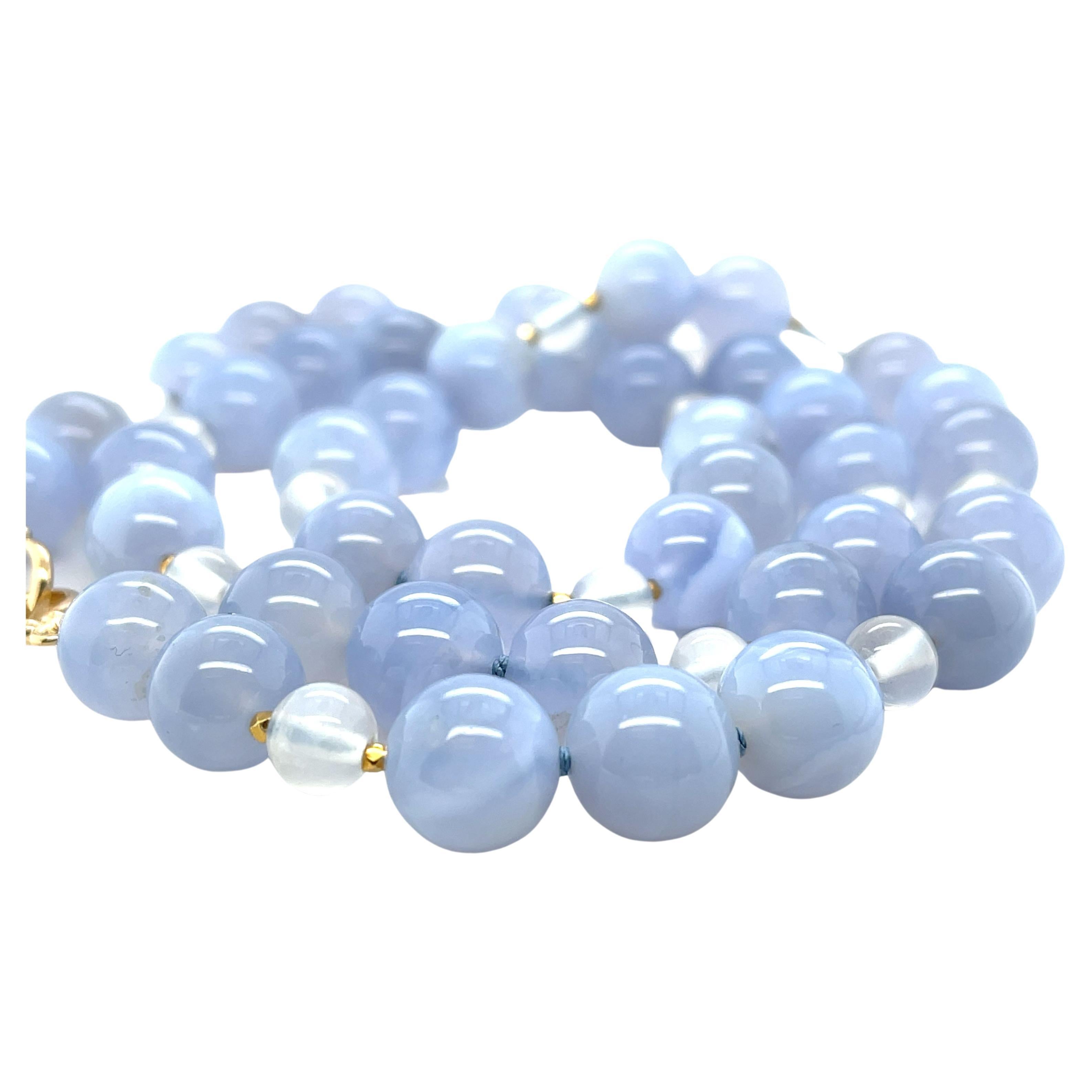 This pretty necklace pairs lovely, translucent 10mm blue chalcedony beads with adularescent blue moonstone for a look of unmistakably refined beauty. Perfect for wearing to the office, lunch with friends, or an elegant evening out! Hand strung on