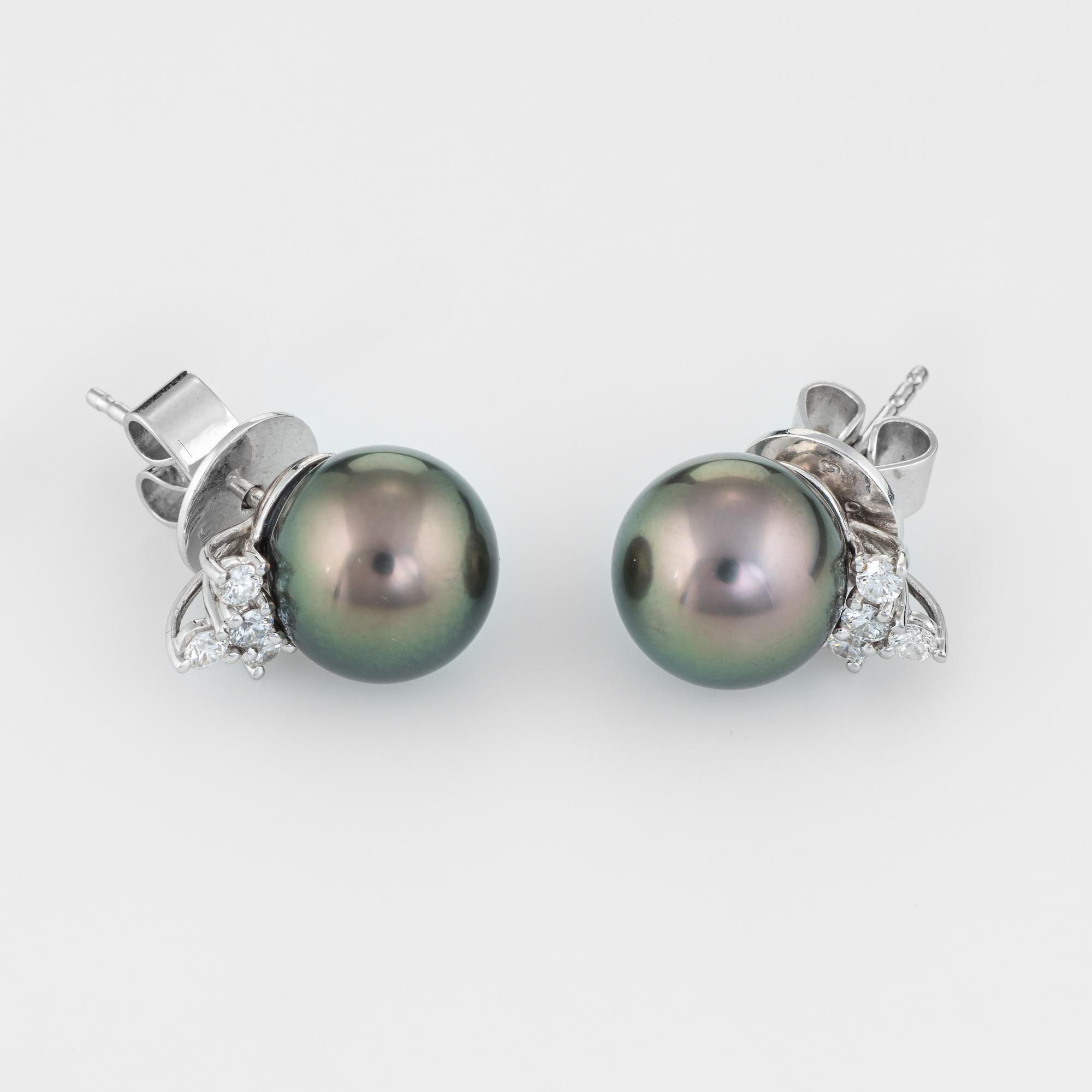 Finely detailed pair of estate cultured Tahitian black pearl & diamond stud earrings, crafted in 18k white gold. 

Two 10mm cultured Tahitian black pearls are accented with six estimated 0.03 carat diamonds. The total diamond weight is estimated at
