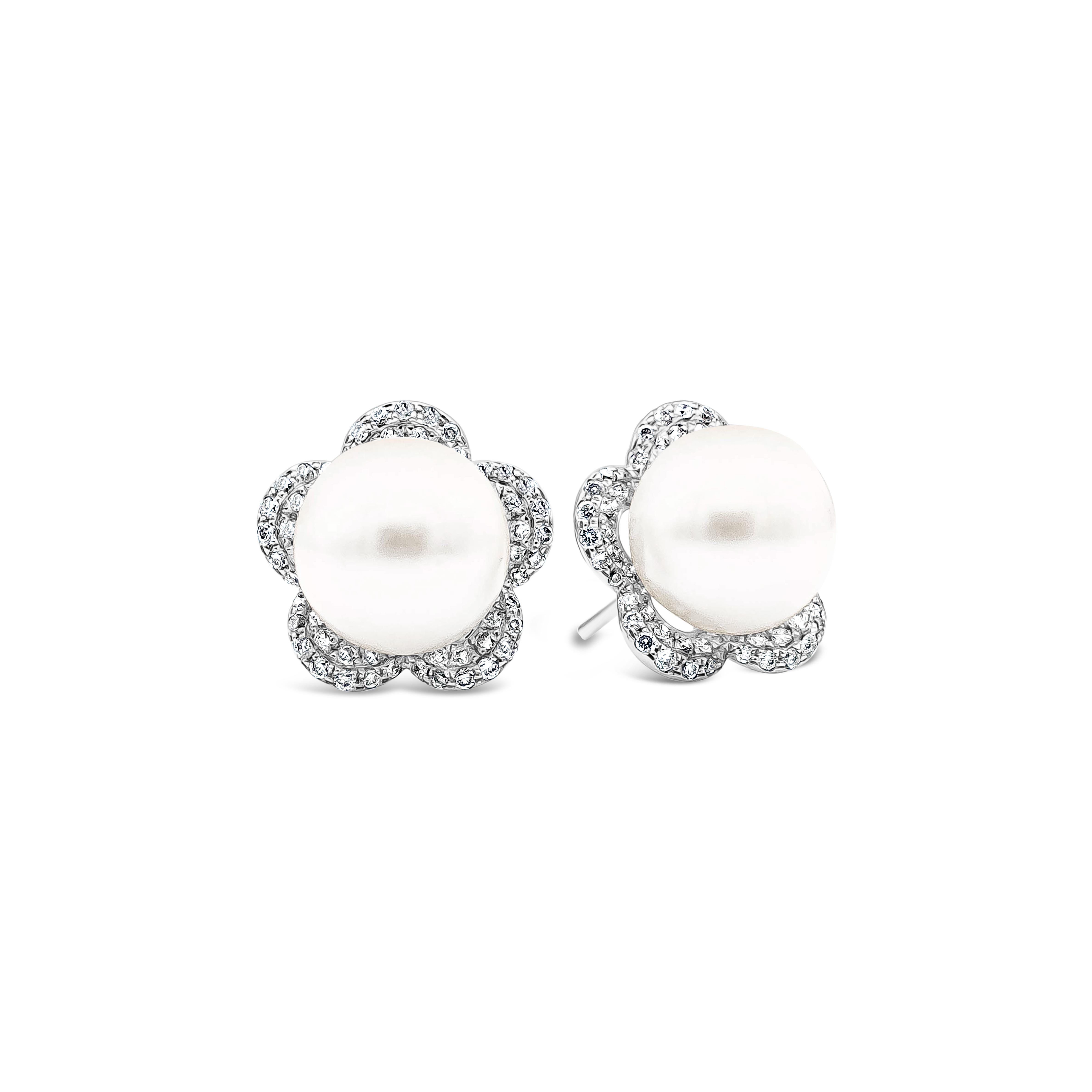 These beautiful and simple stud earrings features 2 cultured pearls each 10mm in diameter set in a floral-motif diamond surmount.Total weight of diamonds 0.73 carats. Perfectly made in 18k white gold.

Style available in different price ranges.
