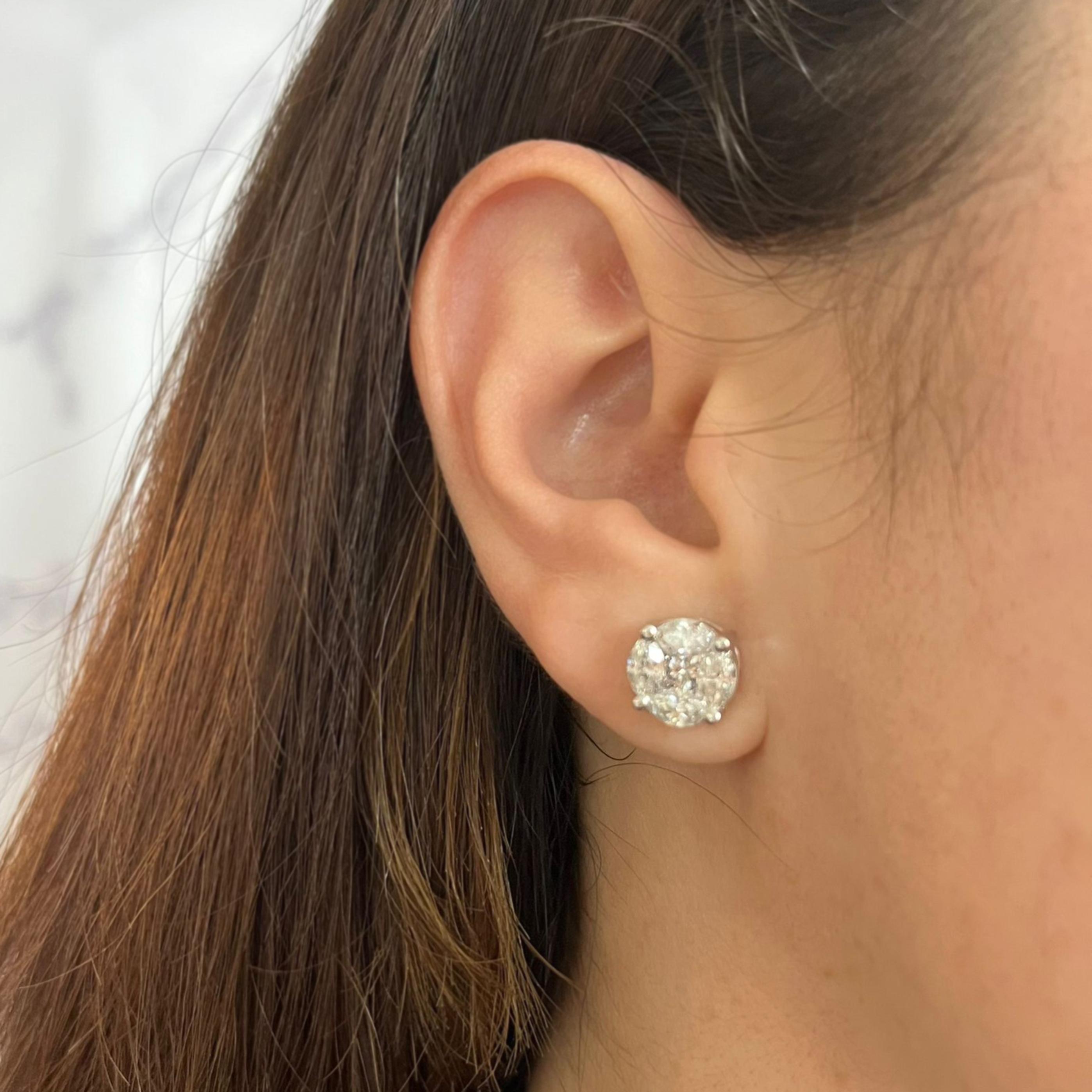 Large 14 karat white gold 10mm round cluster stud earrings featuring 10 marquise and princess cut diamonds of I1 clarity and H color totaling approximately 3.00 carats. Pierced post with friction back. Finished weight is 4.0 grams.