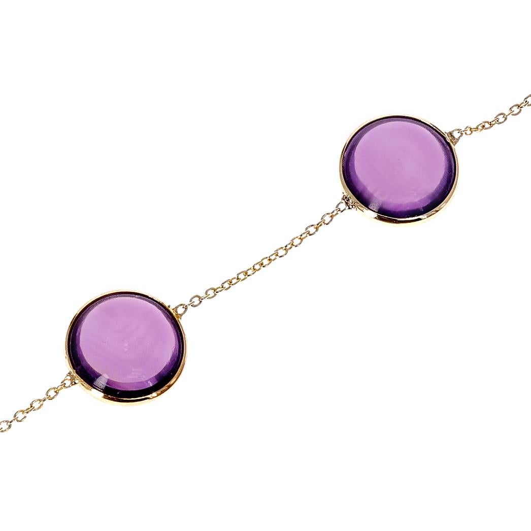 A 10MM Genuine Round Amethyst  18K Yellow Gold Bracelet. The length of the bracelet is 7.50.