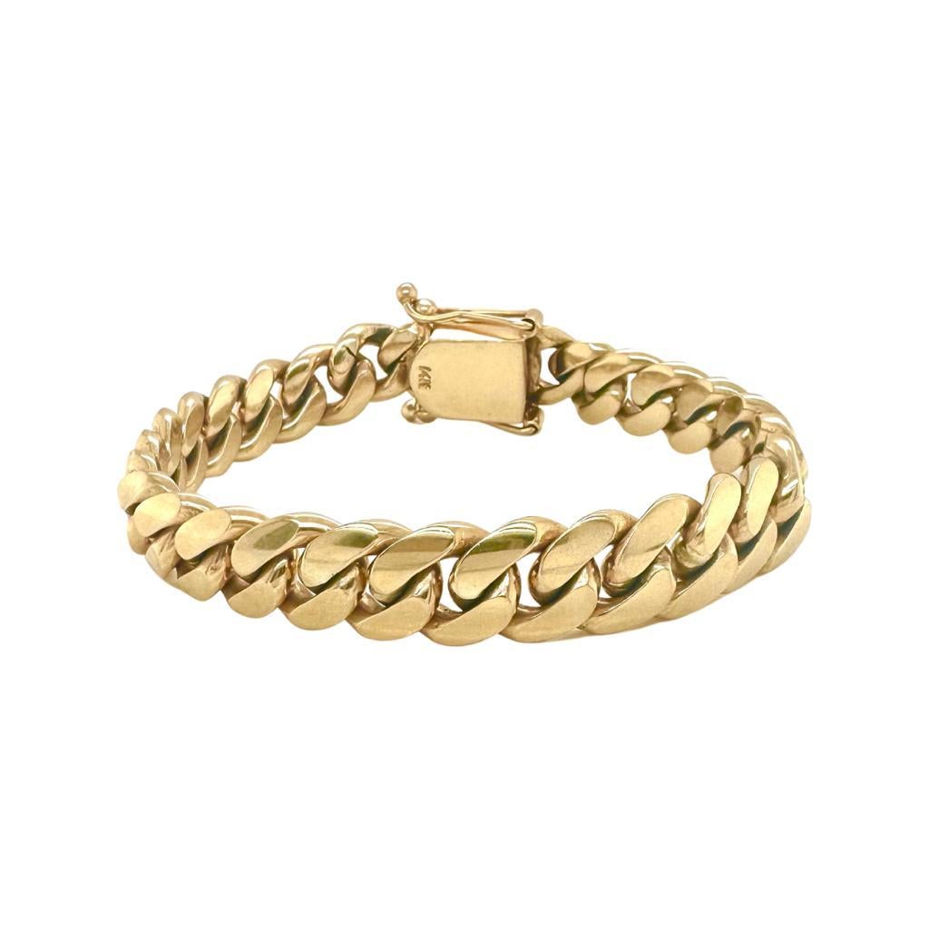 Style:  Cuban Link Chain

Metal:  Yellow Gold

Metal Purity: 14K

Bracelet Weight Grams: 67.5 grams

Bracelet Size: 8 inches

Bracelet Width: 10mm

Closure: Secure box clasp with two locks

Includes: 24 Month Brilliance Jewels Warranty
             