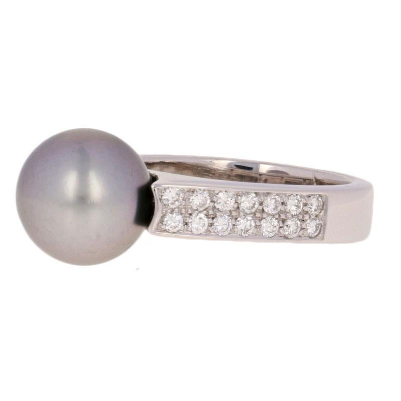 Modern sophistication defined! Fashioned in 18k white gold, this stunning ring showcases a luminous Tahitian grey pearl framed by a sparkling collection of diamonds which cascade down the ring’s shoulders. 

This ring is a size 6 - 6 1/4, but it can