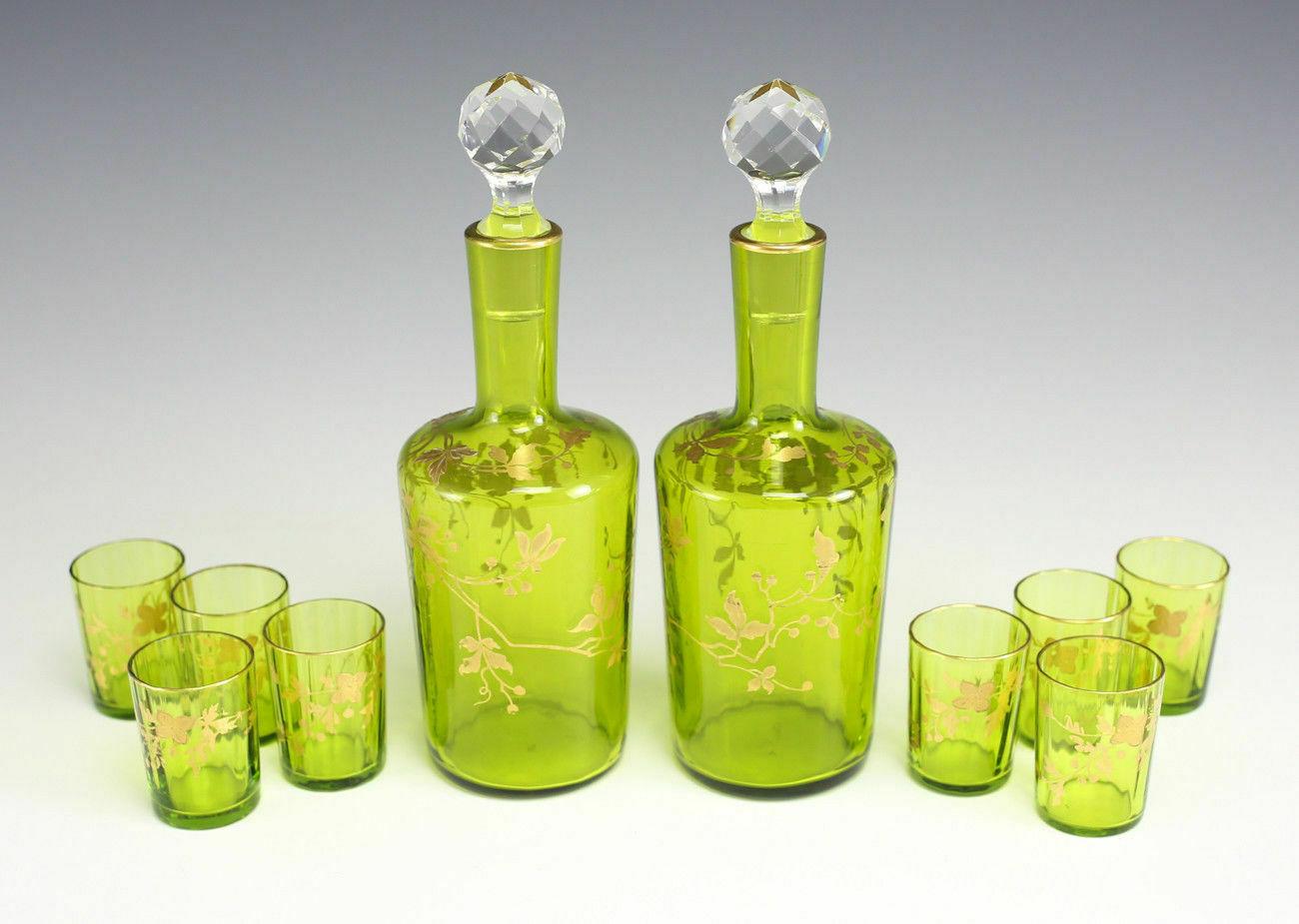 10pc set Czech Bohemian Moser hand painted double carafes & 8 glasses.

10pc set unmarked Moser, Czech / Czechoslovak Bohemian hand painted twin carafes and 8 glasses of appetizer, apple or lime. Relief golden leaves and ivy on subtly fluted