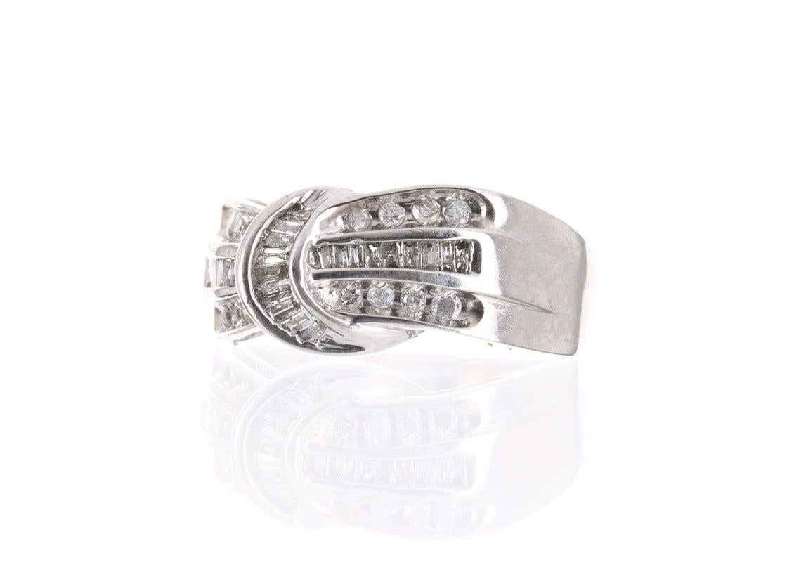 This is an impressive baguette and round diamond ribbon ring. Baguette diamonds are meticulously hand picked fit the setting. Set in 10K white gold. Complimentary ring size and shipping within the USA with this purchase!

Stone Information:
Natural