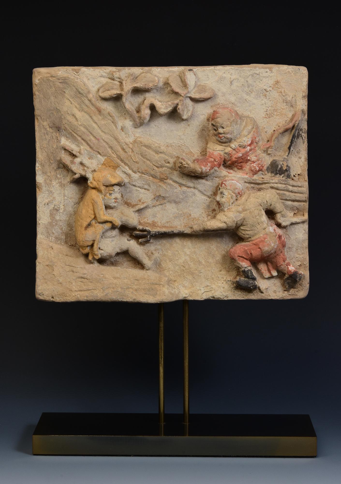 Antique Chinese painted pottery panel with figures, with original pigments remaining.

Age: China, Song Dynasty, 10th - 12th Century
Size of panel only: Height 24.2 C.M. / Width 28.2 C.M. / Thickness 5 C.M.
Height including stand: 39.8