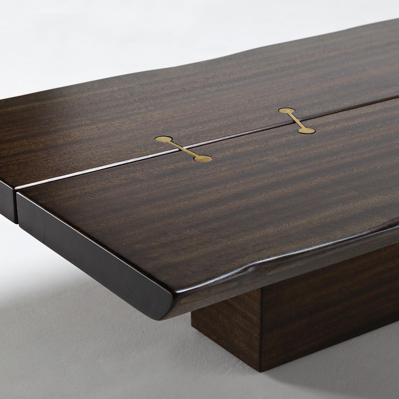 Reinventing a contemporary setting with unexpected iconic character, this stupendous coffee table by Massimo Castagna will take center stage in both indoor and outdoor decors. Fashioned of barriquet-finished mahogany, the striking top features