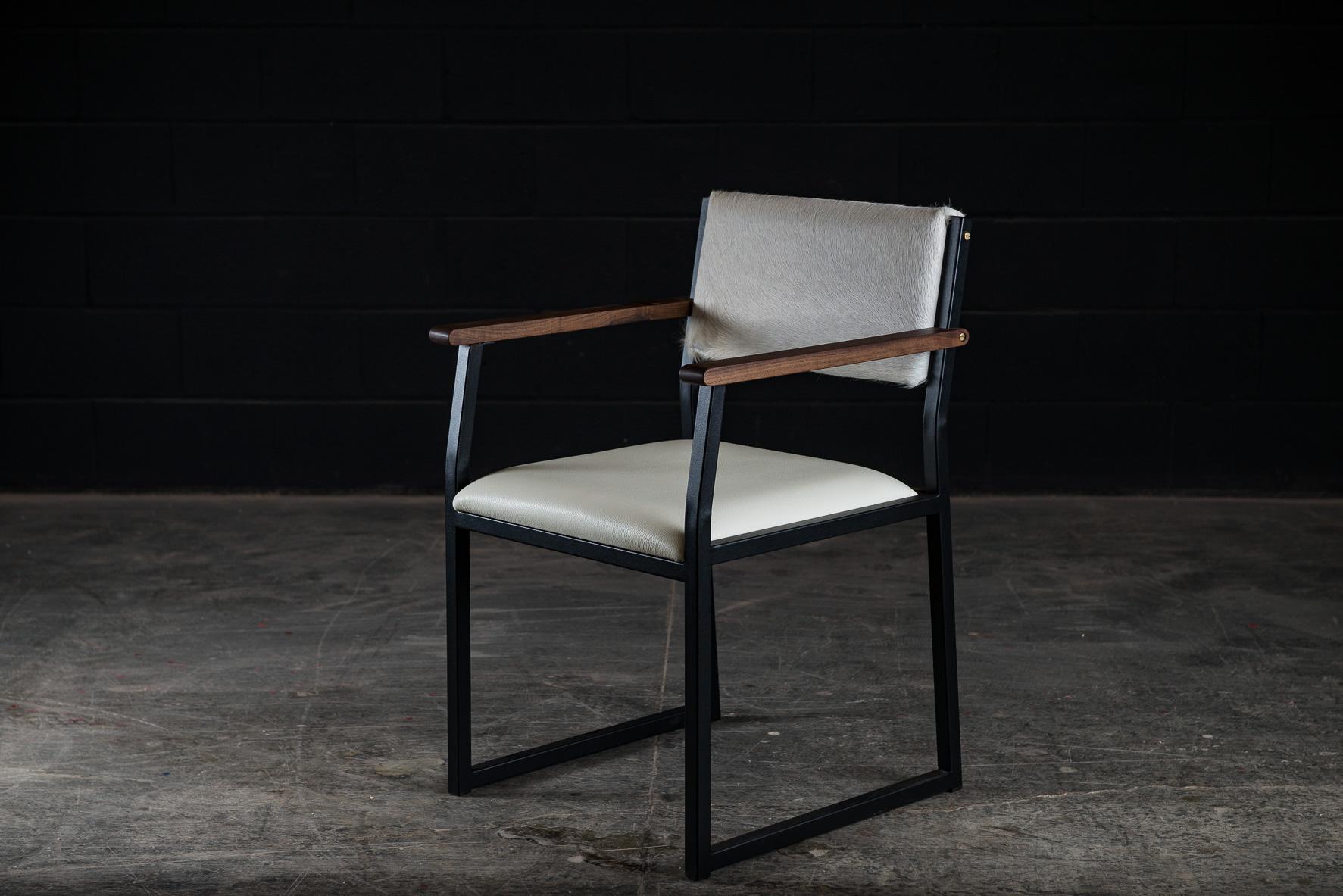 The Shaker modern armchair is handmade to order from our unique Ambrozia black textured steel frame. Very comfy and appreciated from our clients. They are available in a large variety of genuine leather and cowhide options. Featuring subtitle solid
