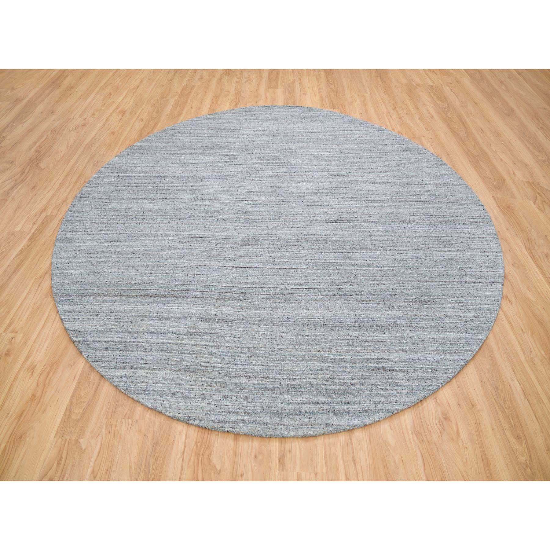 This is a truly genuine one-of-a-kind Arsenic Gray, Pure Wool Hand Loomed, Modern Striae Design, Soft Pile, Natural Dyes, Round Oriental Rug
Primary materials: Wool
Latex: No Pile 
height: 0.25 Inches
Style: Casual
Primary color: Grey
Secondary