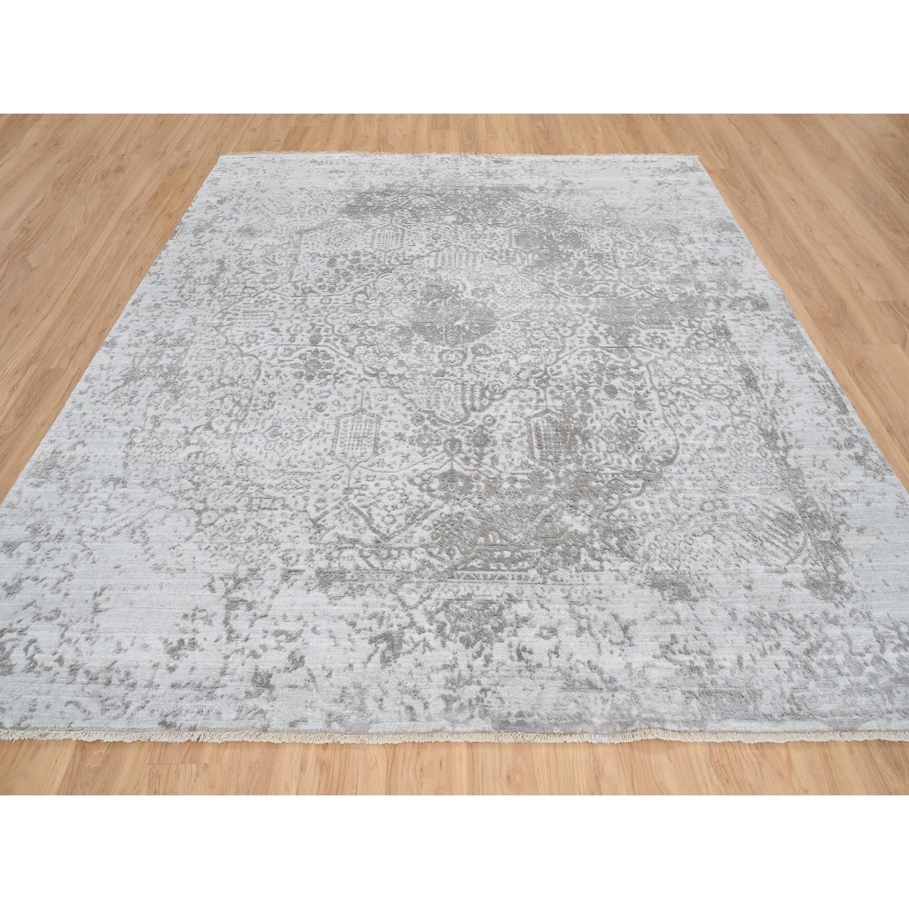 This is a truly genuine one-of-a-kind Gray, Broken Persian Design, Hand Knotted Wool and Pure Silk, Square Oriental Rug. It has been Knotted for months and months in the centuries-old weaving craftsmanship techniques by expert artisans.
Primary