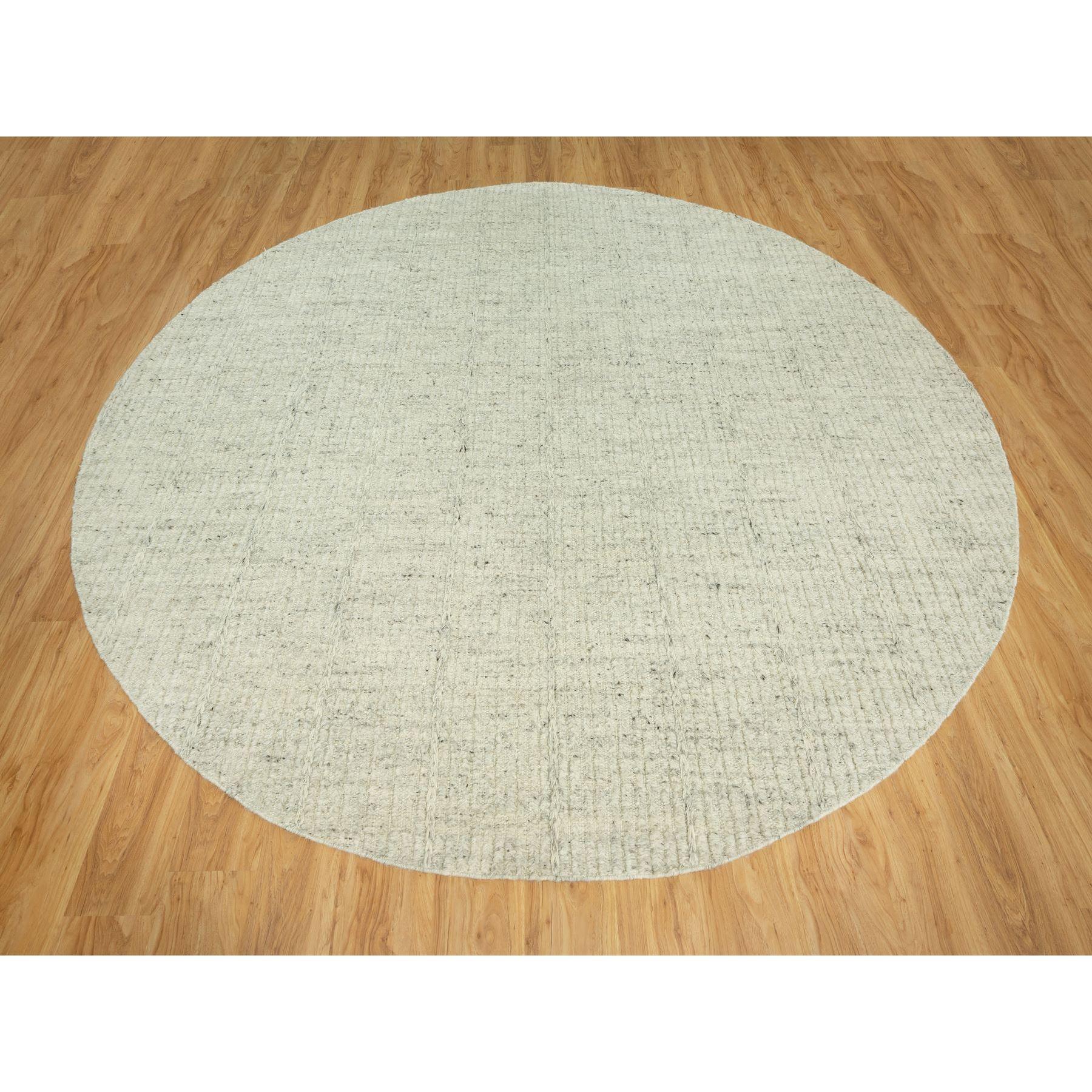 Halo Gray, High and Low Pile, Flat Weave, Plain and Simple, Organic Wool, Hand Woven, Cord Collection,  Round Oriental Rug
Primary materials: Wool
Latex: No Pile 
height: 0.25 Inches
Style: Traditional
Primary color: Grey
Secondary colors: