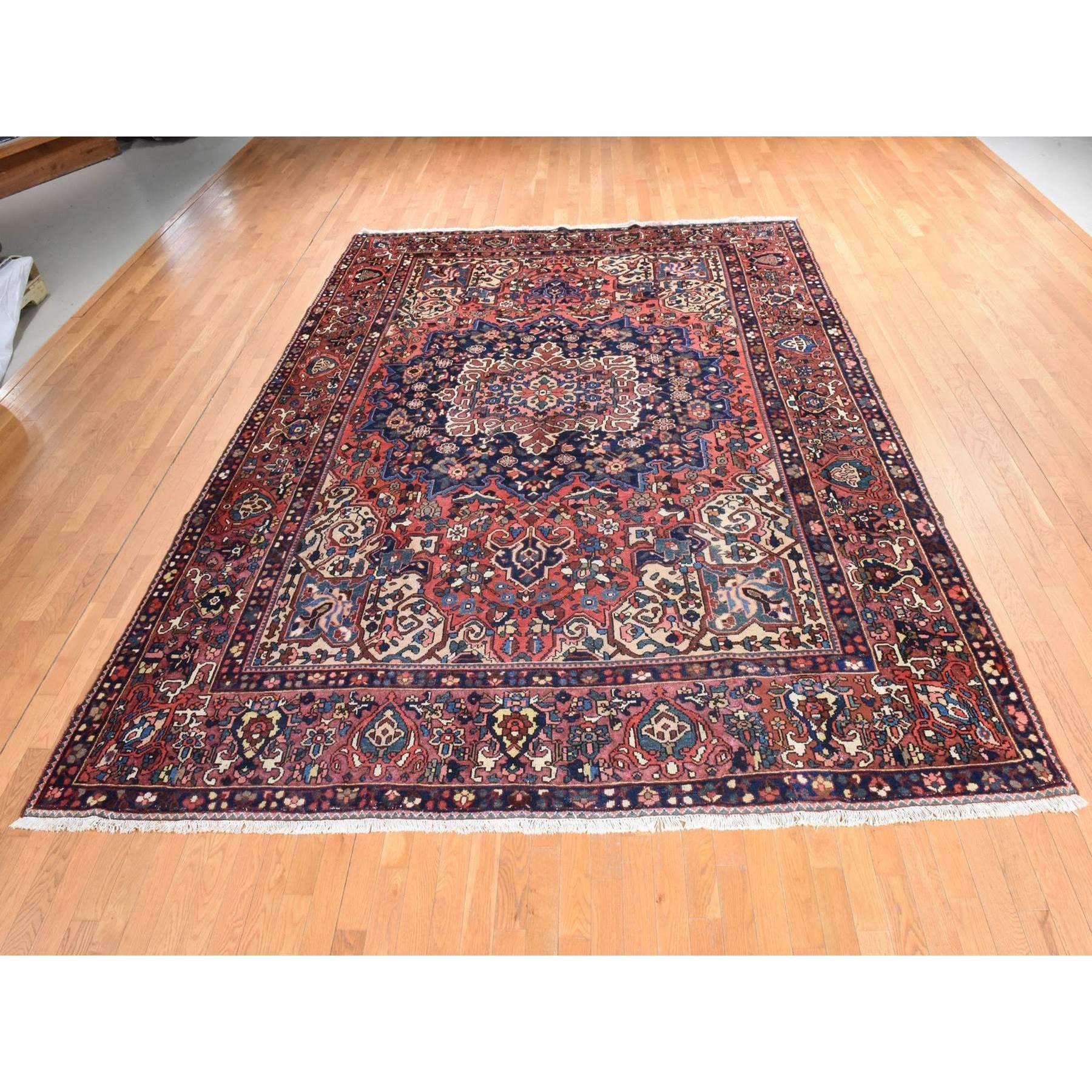 Coral Red, Semi Antique Persian Bakhtiar, Full Pile, Good Condition and Clean, 100% Wool, Hand Knotted, Oriental Rug
Primary materials: Wool 
Latex: No Pile 
height: 0.25 Inches
Style: Traditional
Primary color: Red
Secondary colors: Midnight Blue,