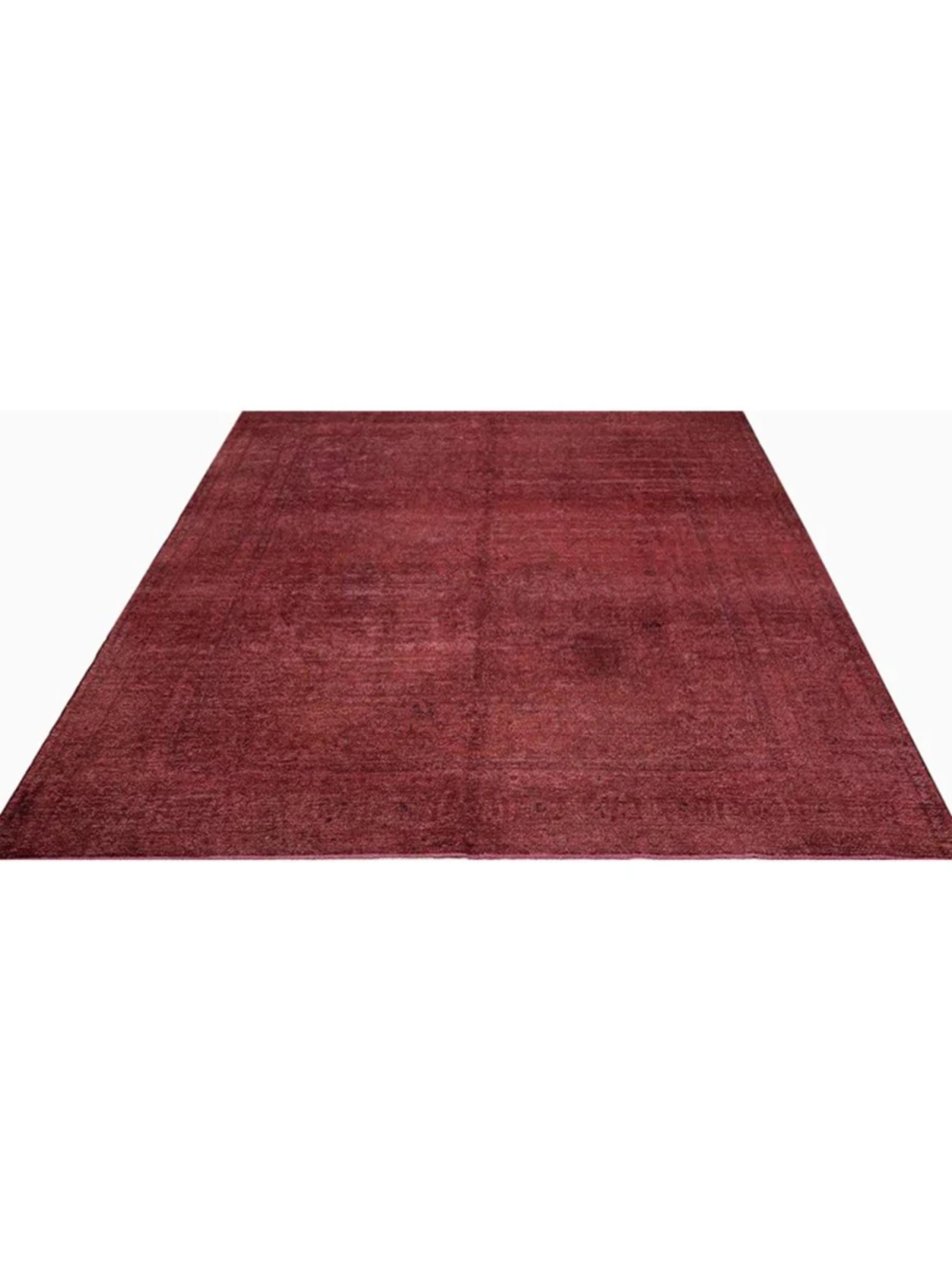 Enhance your space with the 10x13 Vintage Distressed Overdyed Area Rug, a unique piece that combines traditional craftsmanship with modern style. Hand-knotted from premium wool, this rug is both durable and luxurious, offering a soft texture