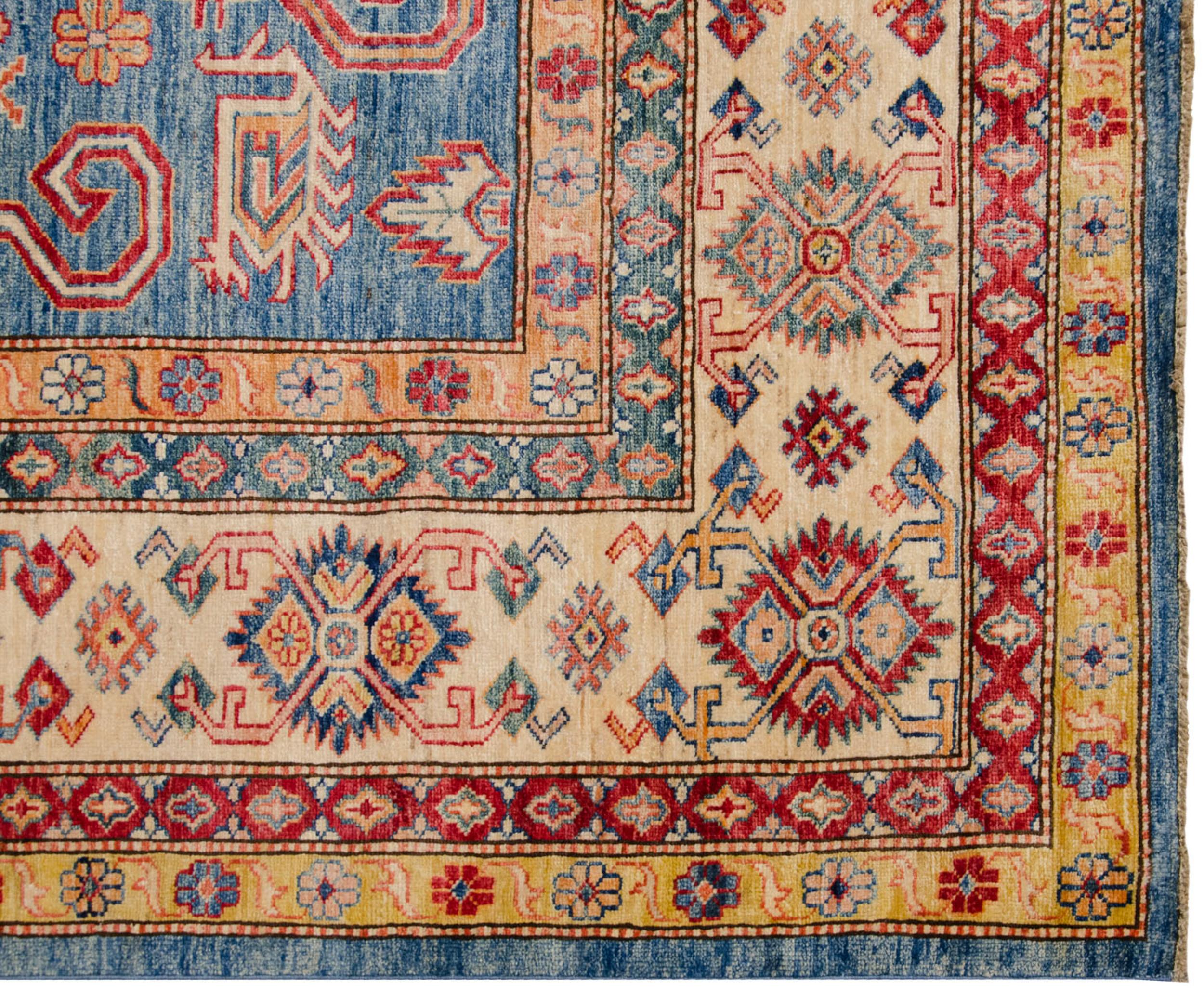 :: Covered field in a rams horn classic Caucasian Perpedil design motif atop a covered field of floral top views and germinating plants. Colors and shades include: Sky blue, ivory, cherry red, dusty saffron yellow, ivory and more. Condition notes: