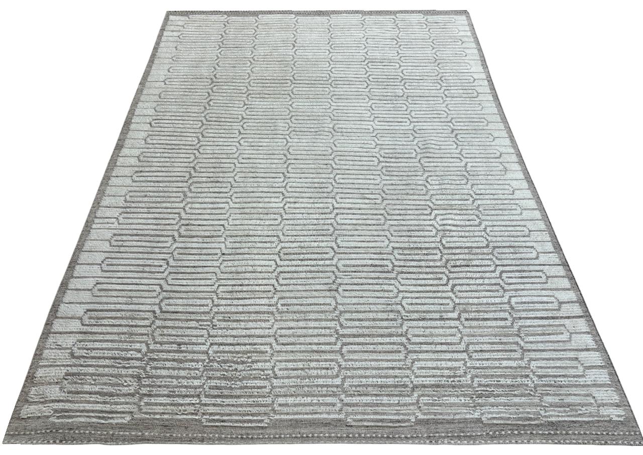 Elevate your living space with the exquisite charm of this new modern hand-knotted Moroccan berber beni ourain rug, crafted with precision and care from 100% wool. Combining the allure of Moroccan design with contemporary sensibilities, this rug is