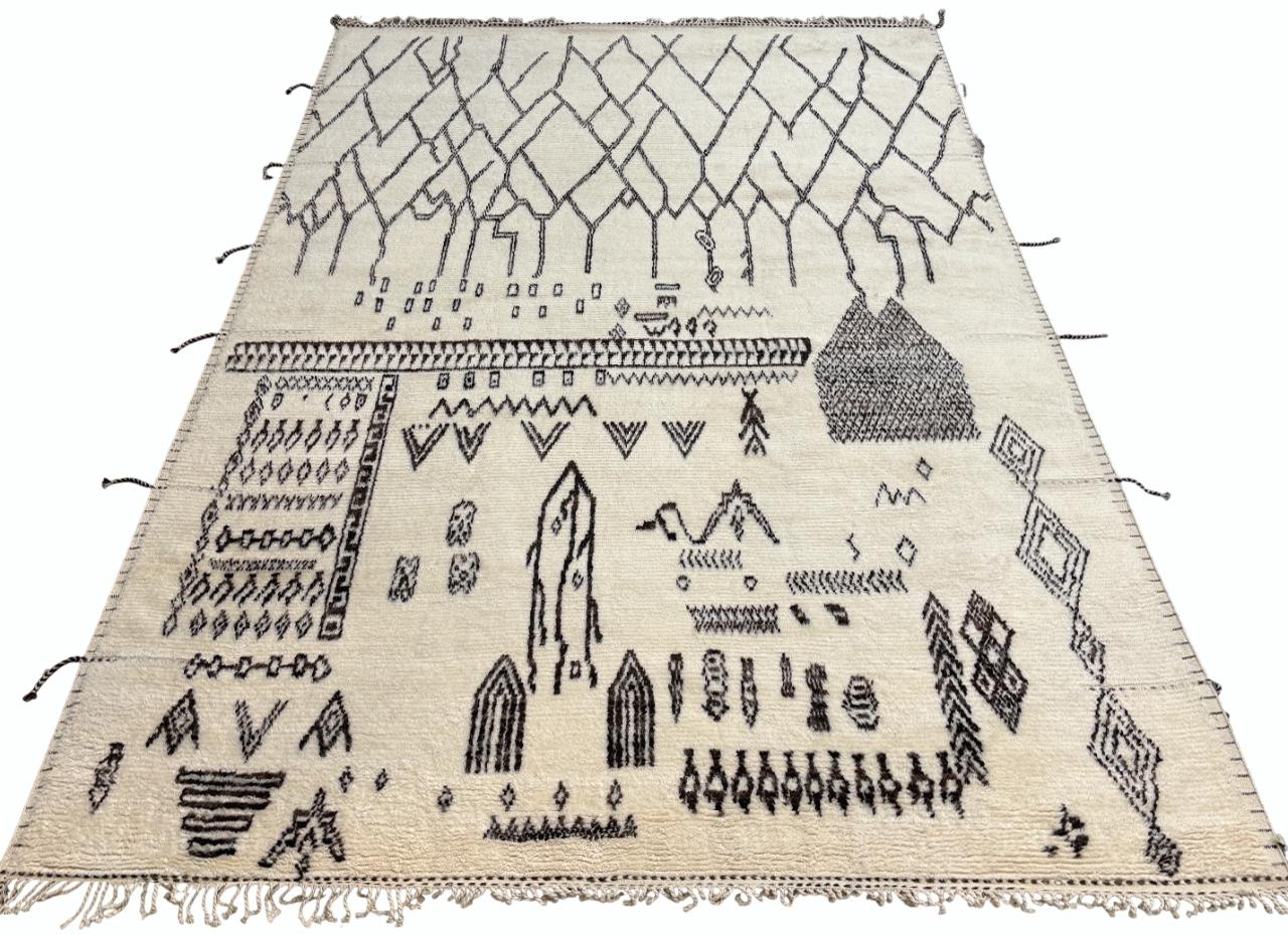 Elevate your living space with the exquisite charm of this new modern hand-knotted Moroccan berber beni ourain rug, crafted with precision and care from 100% wool. Combining the allure of Moroccan design with contemporary sensibilities, this rug is